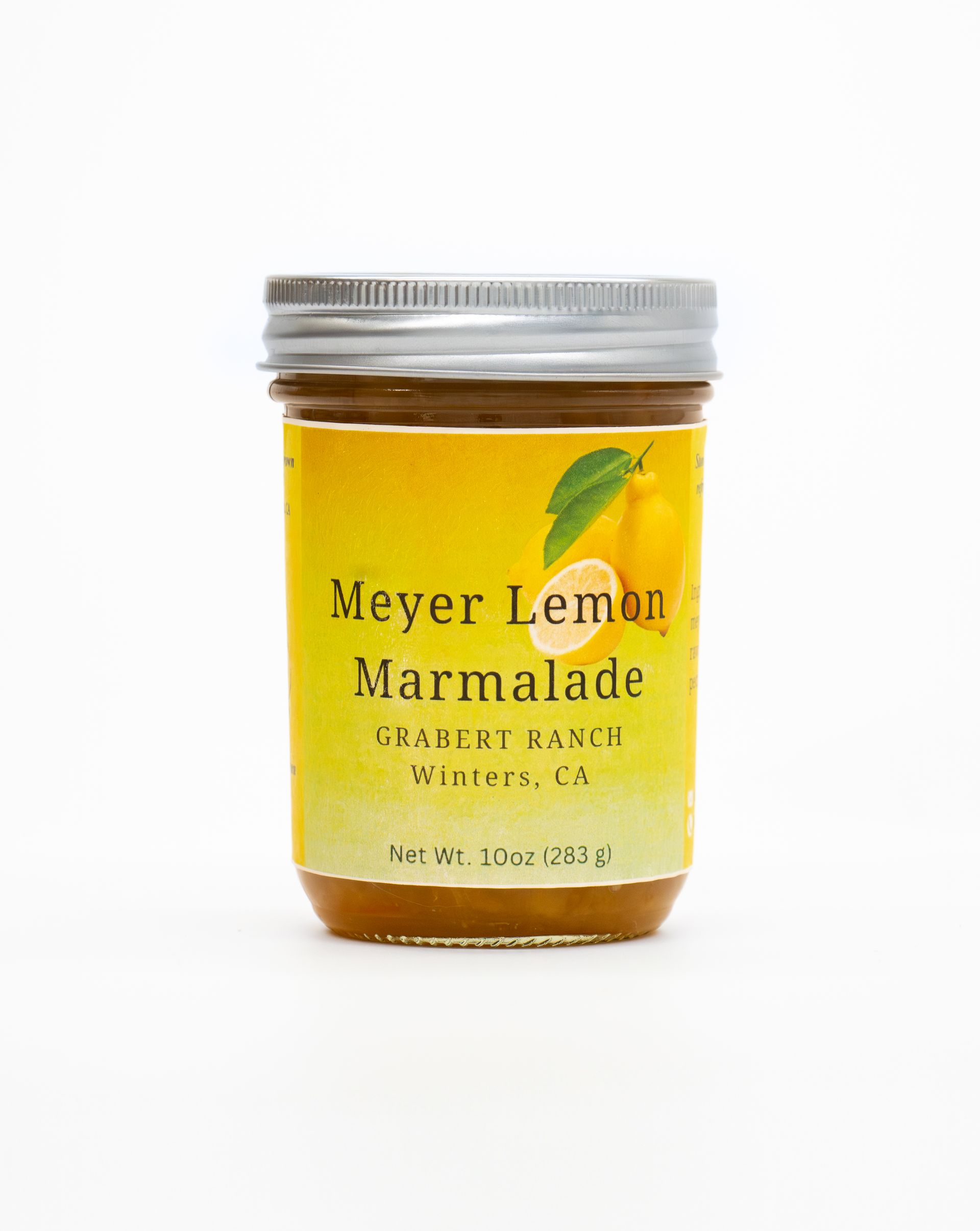 A jar of Meyer Lemon Marmalade from Chauce Ranch, Winters, CA, with a yellow label and silver lid on a white background.