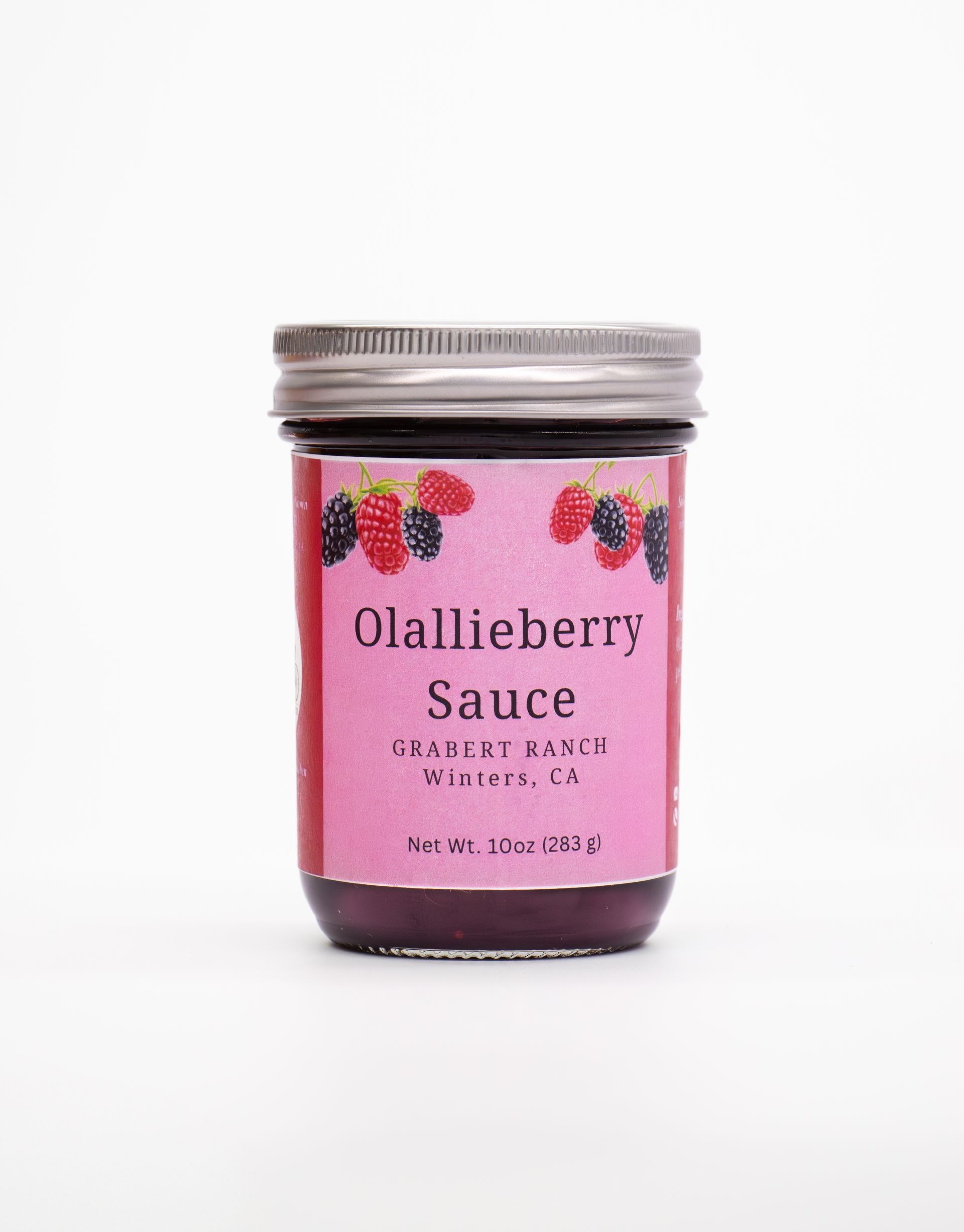 A small jar of Olallieberry sauce with a pink label featuring berry illustrations and a silver metal lid.