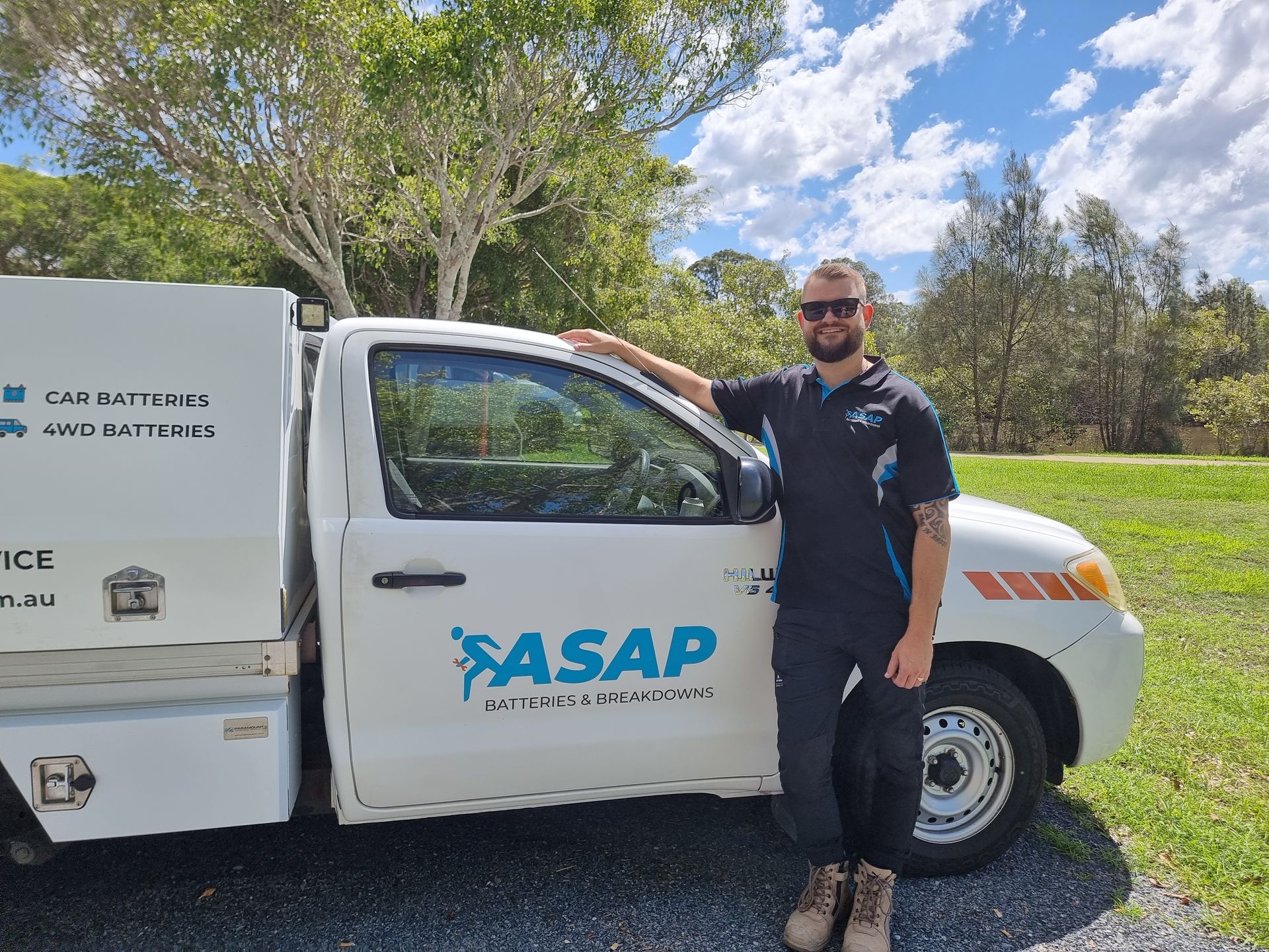 Man in Work Uniform Stands — ASAP Batteries & Breakdowns in Robina, QLD