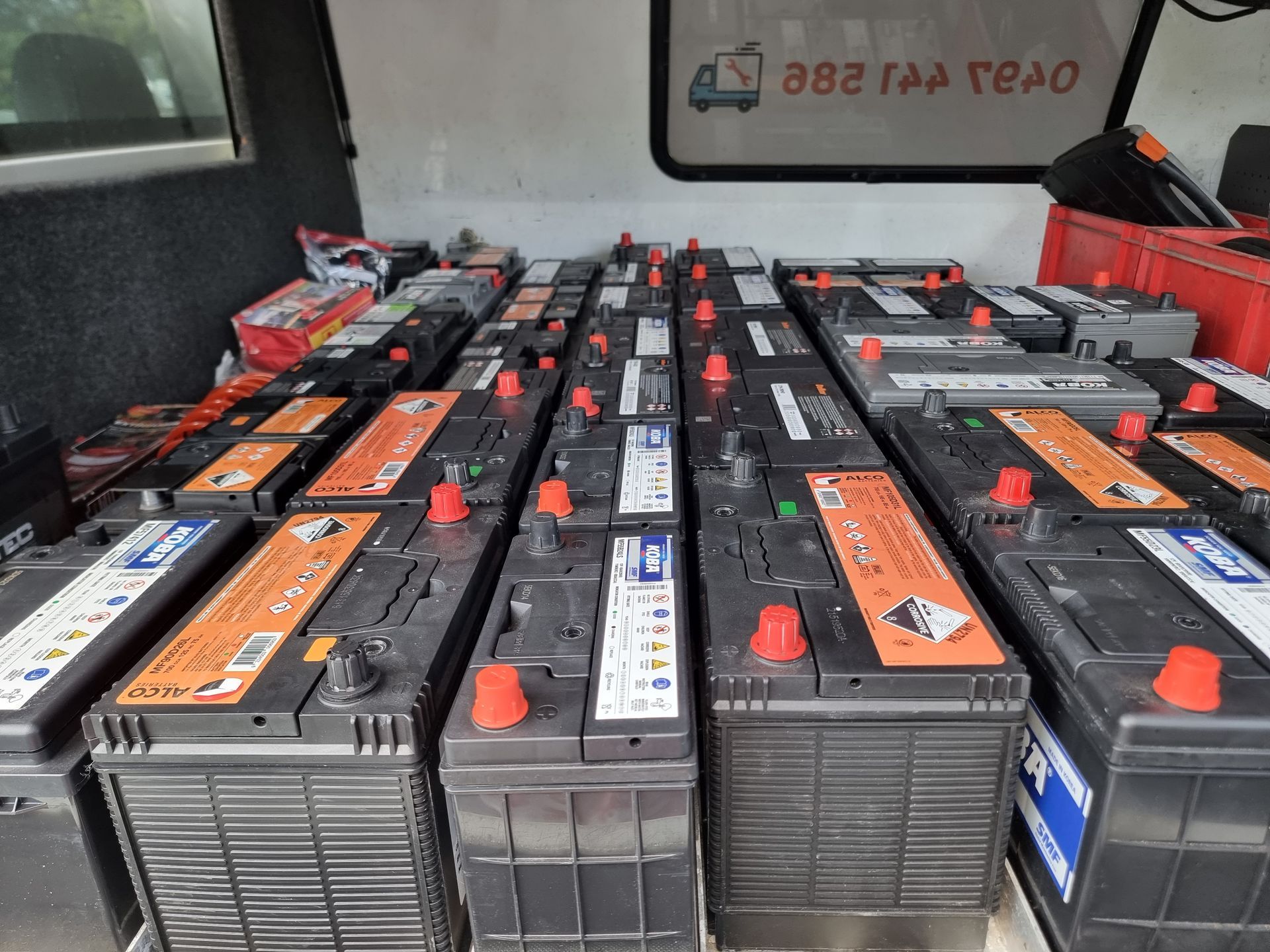 A Collection of Rectangular Black Car Batteries With Red Terminals — ASAP Batteries & Breakdowns in Helensvale, QLD