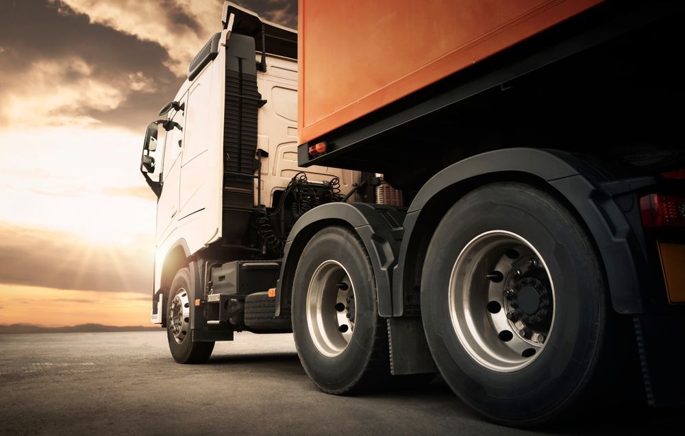 Two Black Truck Batteries on a Concrete Surface — ASAP Batteries & Breakdowns in Helensvale, QLD