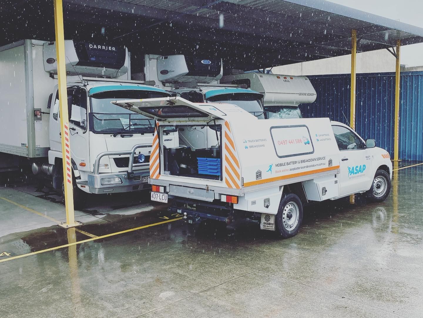 A White Utility Truck With an Open Rear Storage Compartment — ASAP Batteries & Breakdowns in Coomera, QLD