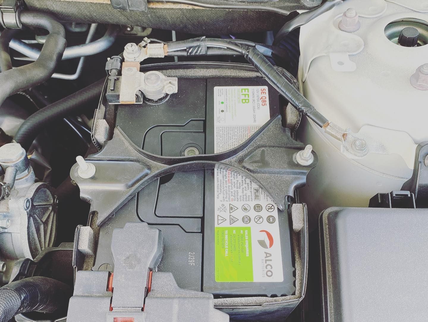 A Car Engine Bay Showing an Alco EFB Battery Secured — ASAP Batteries & Breakdowns in Southport, QLD
