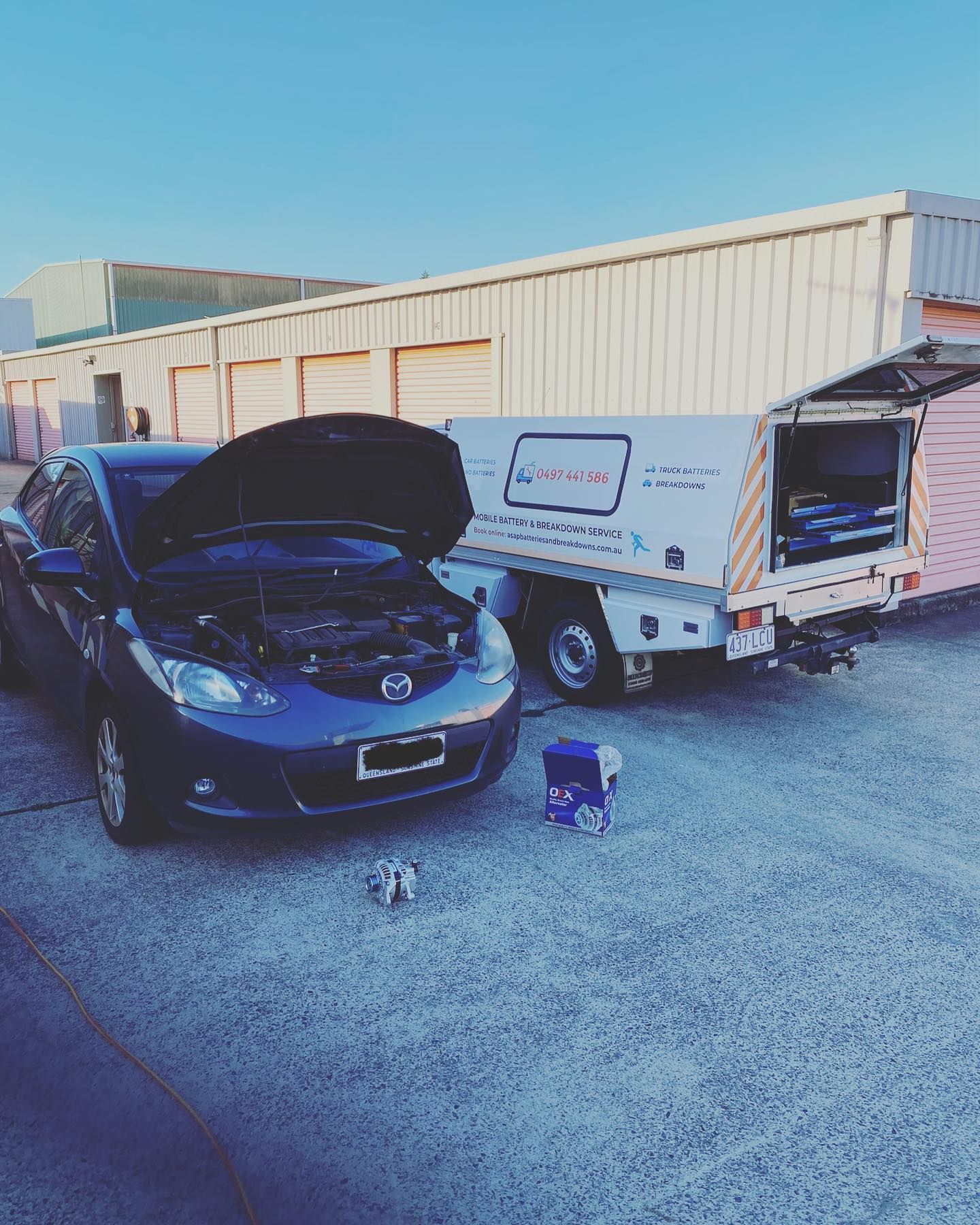 A Blue Car With Its Hood Open Parked — ASAP Batteries & Breakdowns in Tweed Heads, NSW