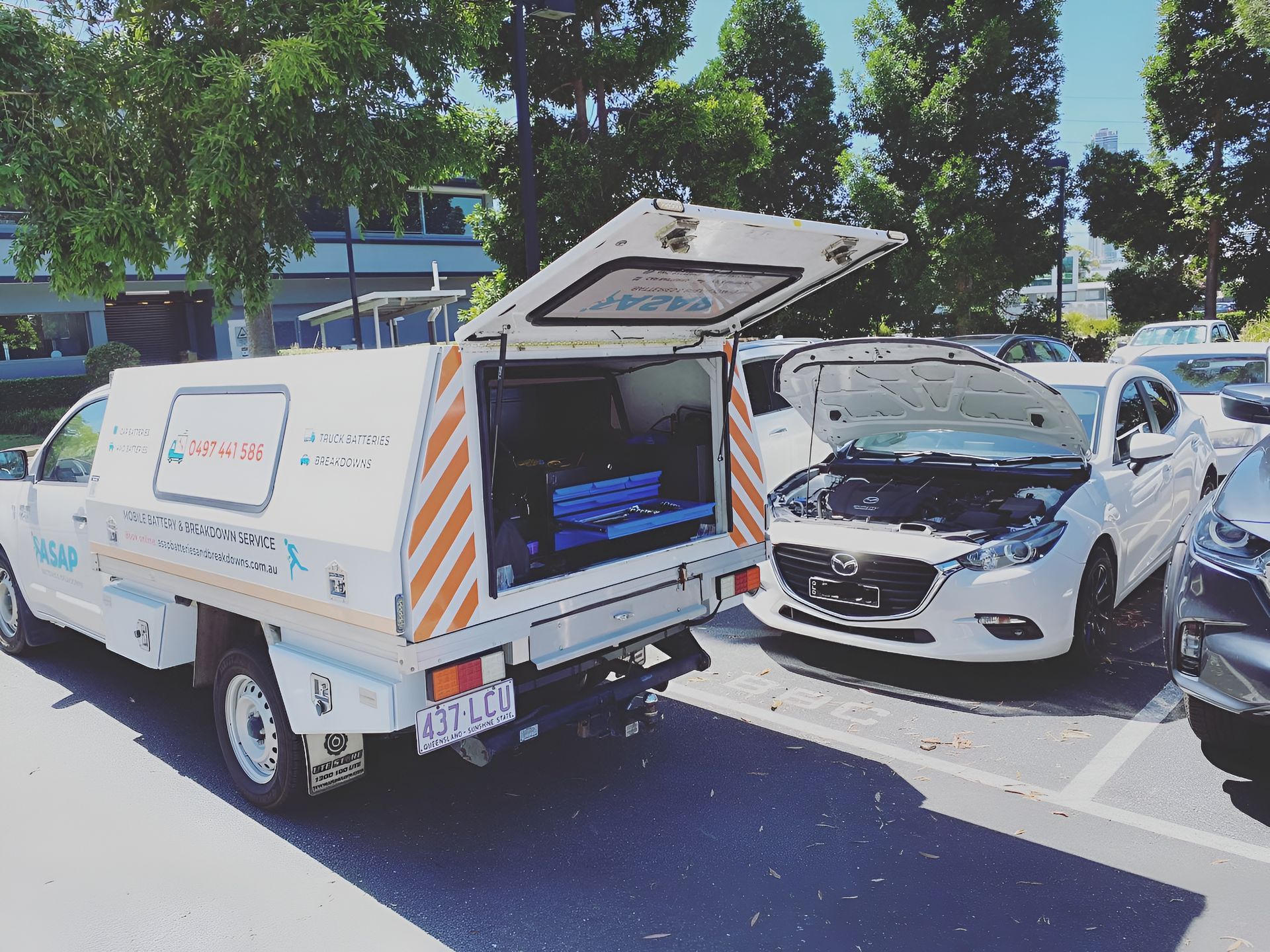 A White Service Truck With an Open Cargo Bed Parked — ASAP Batteries & Breakdowns in Nerang, QLD