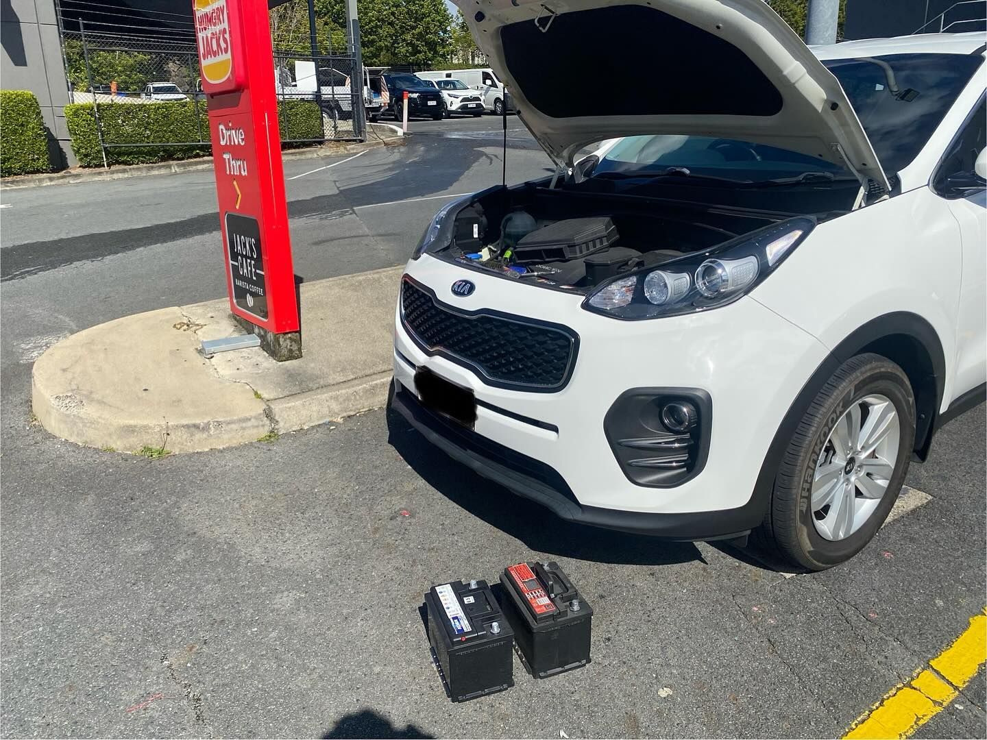 White Kia Sportage With Open Hood; Two Car Batteries — ASAP Batteries & Breakdowns in Helensvale, QLD
