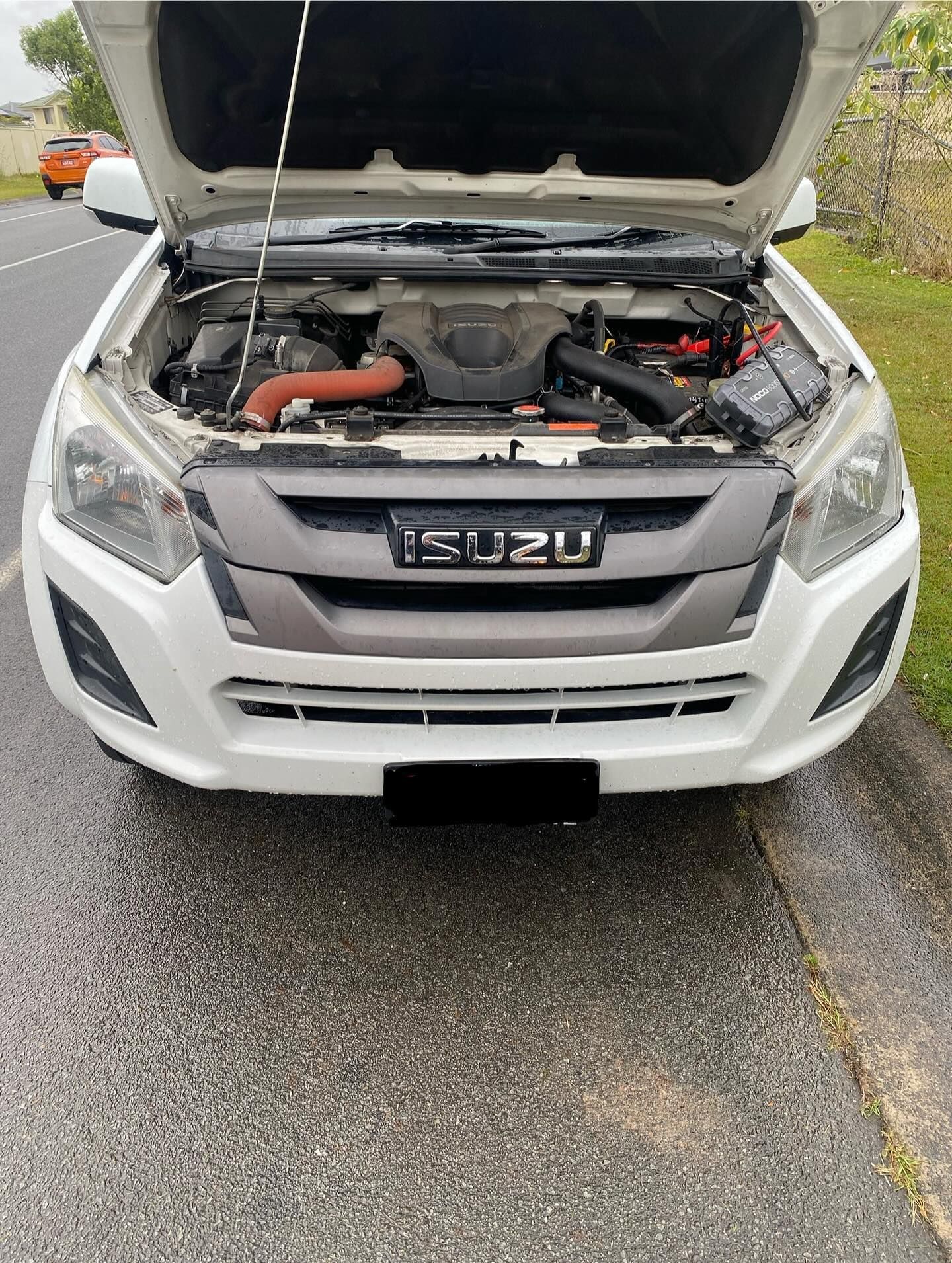 White Isuzu Truck With Open Hood — ASAP Batteries & Breakdowns in Helensvale, QLD