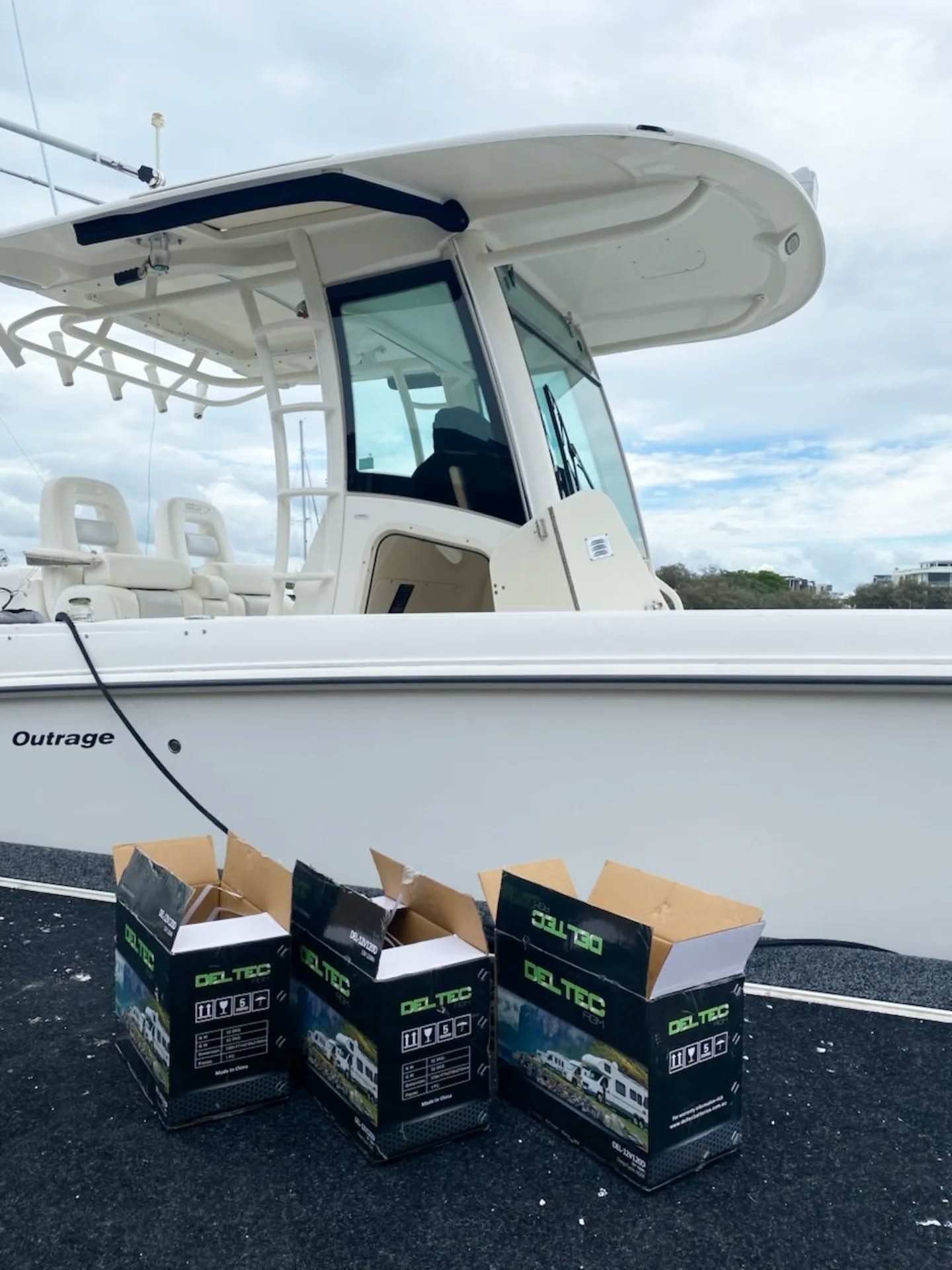 Three Open Deltec Boxes Sit on a Dark Dock — ASAP Batteries & Breakdowns in Tweed Heads, NSW