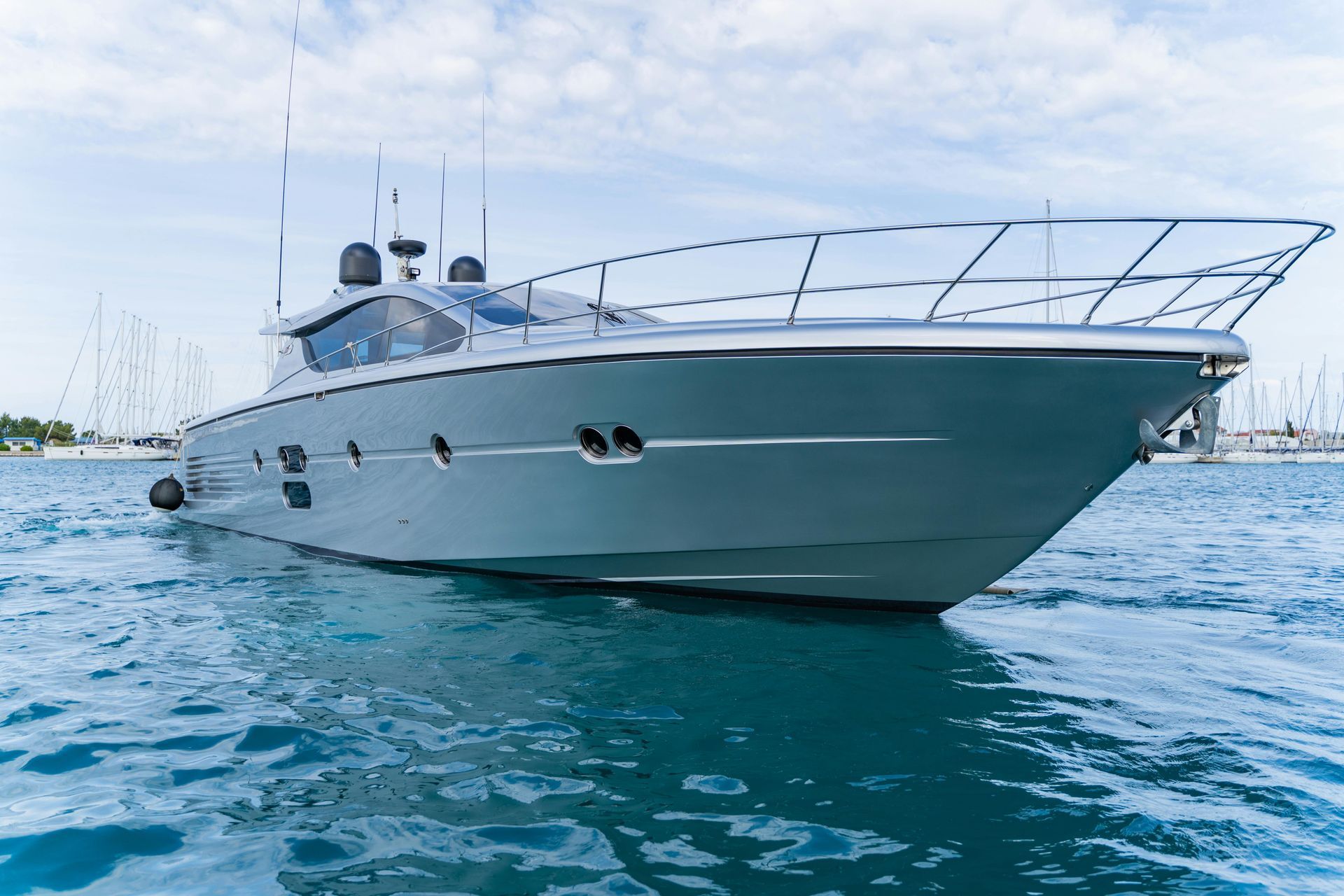 A Sleek, Silver Motor Yacht Floating on Calm, Blue Water — ASAP Batteries & Breakdowns in Nerang, QLD