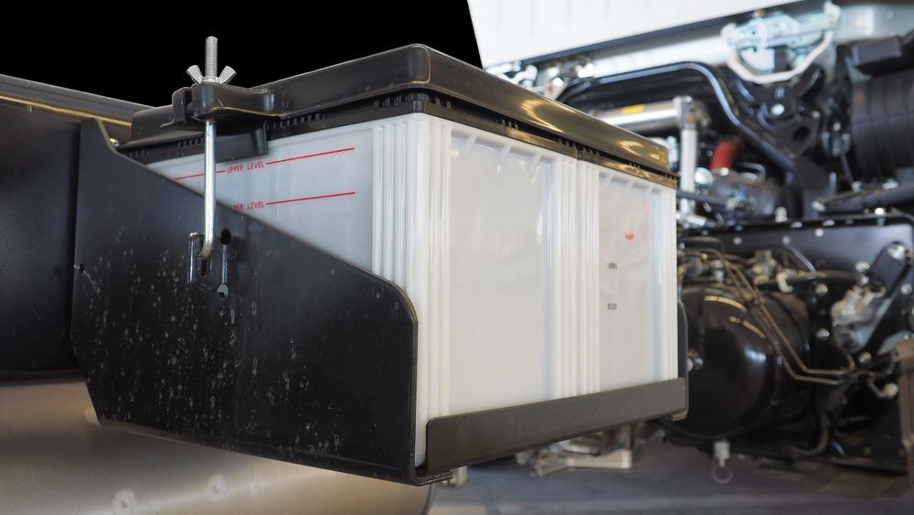 Large Rectangular Battery in a Black Bracket, With a Securing Clamp — ASAP Batteries & Breakdowns in Helensvale, QLD