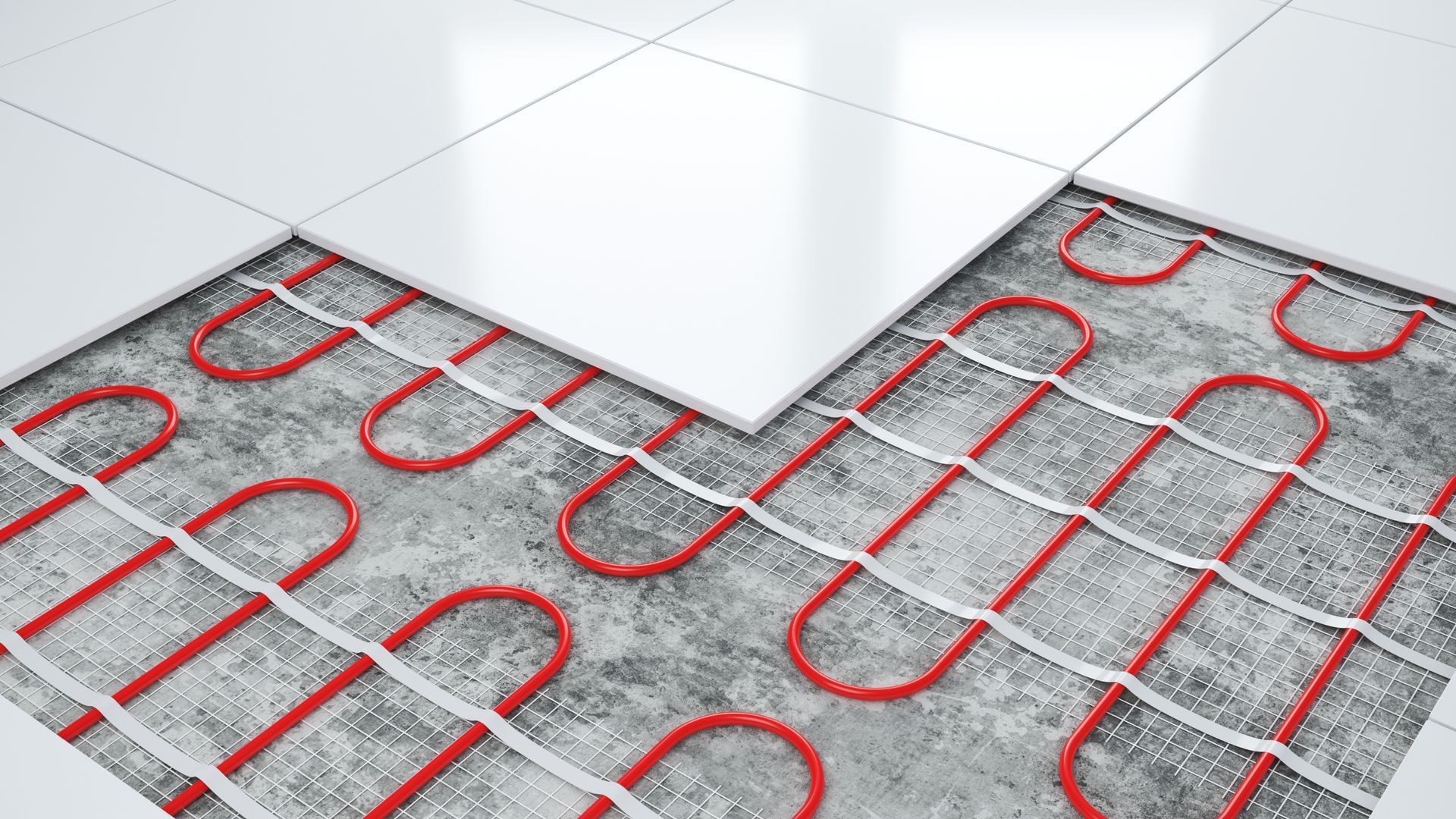Un gros plan d'un plancher chauffant avec carrelage et tuyaux.