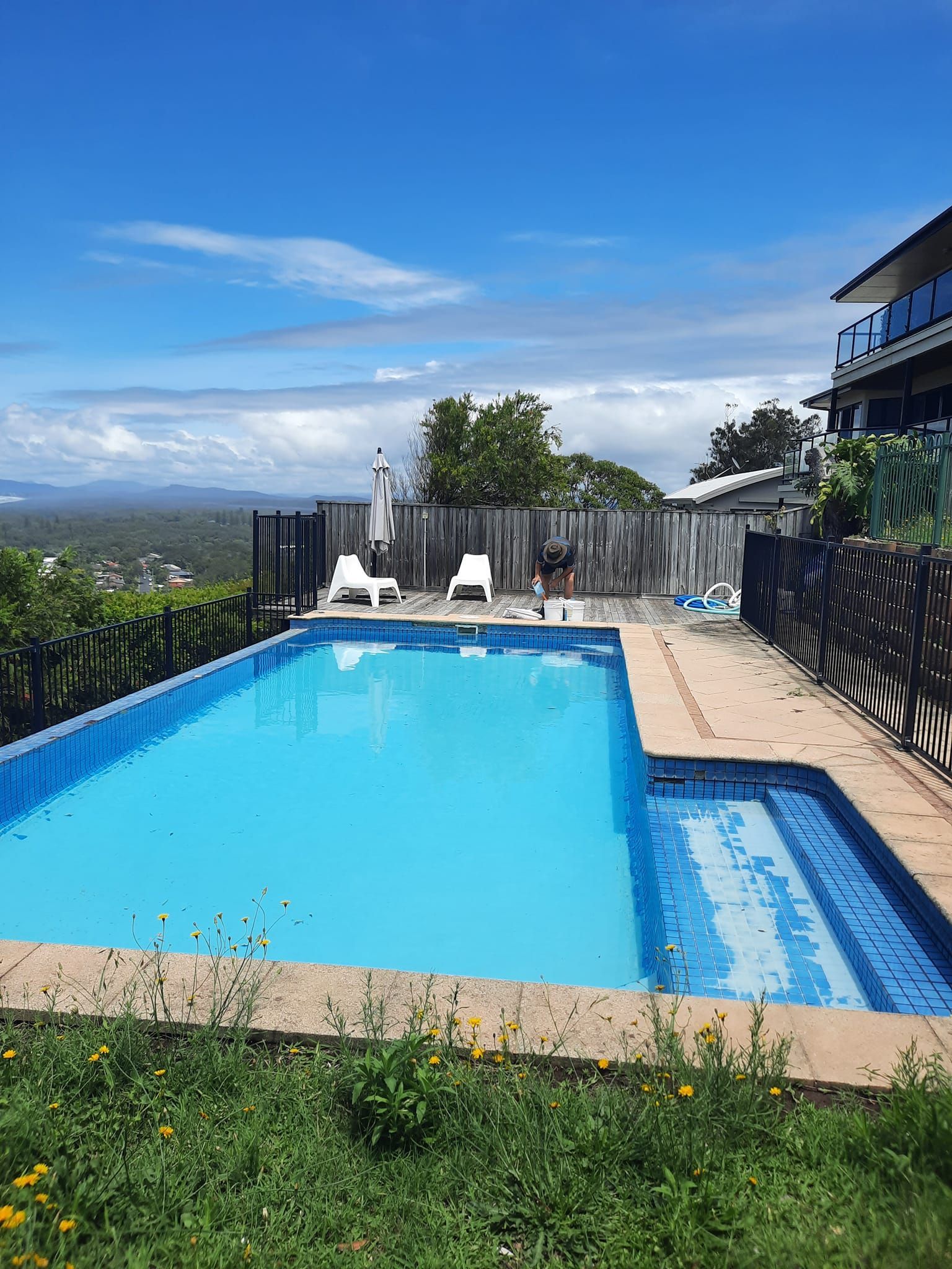 Blue Pool Cover on a Rectangular Pool, Surrounded by a Concrete Patio — Donna's Pool & Spa Centre In Port 