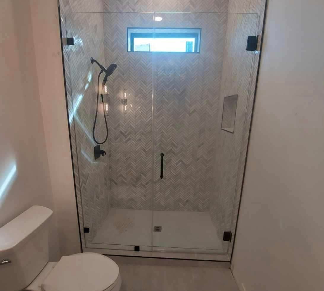 Frameless shower door 140