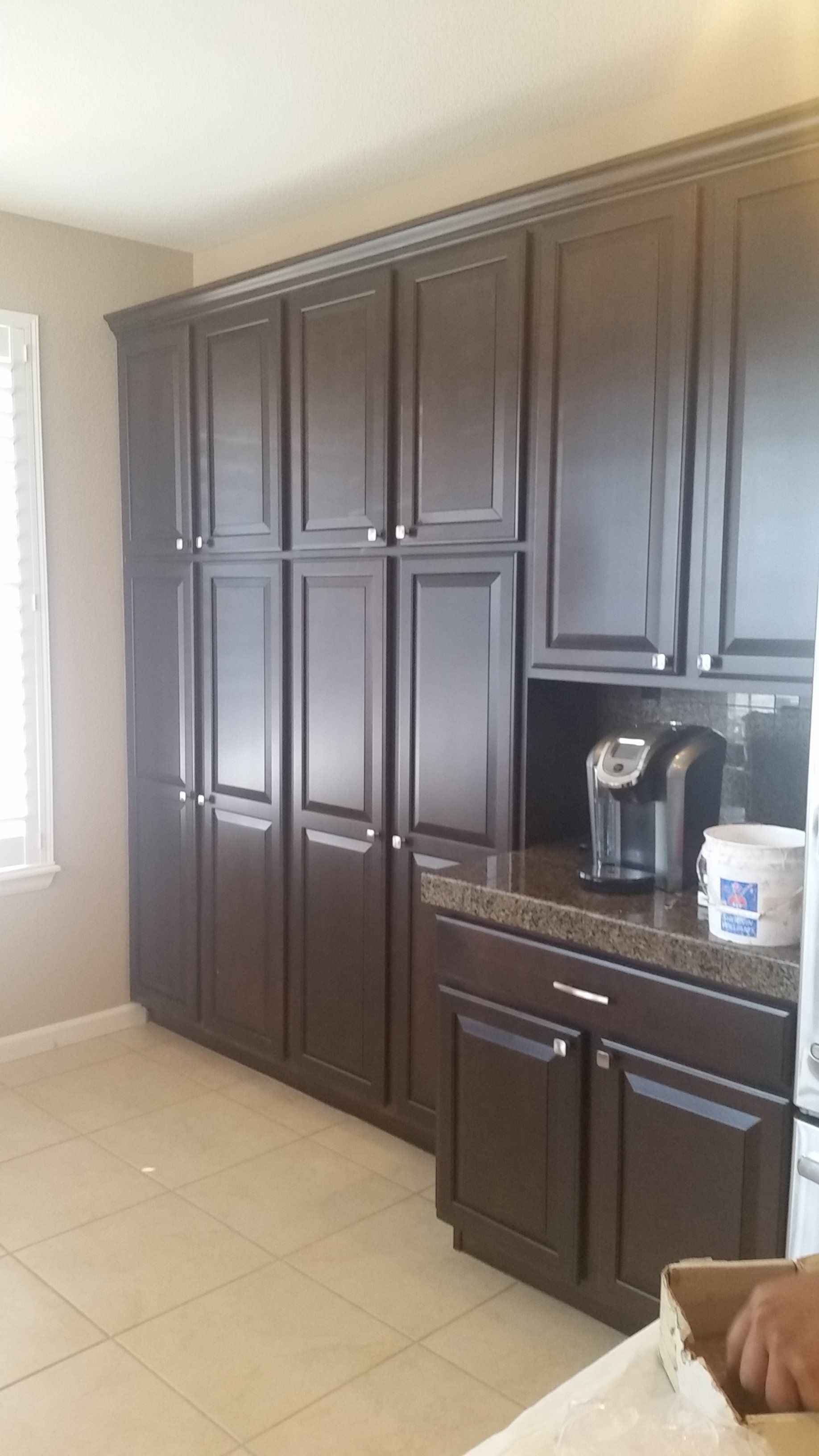 newly finished kitchen cabinets in espresso brown