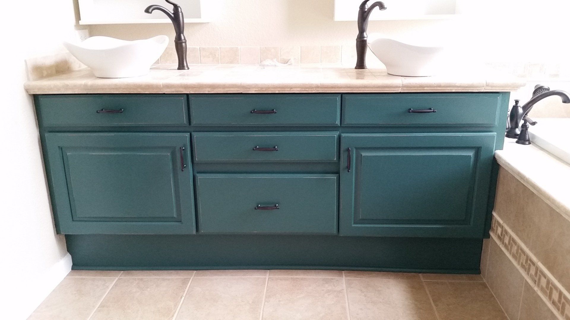 green bathroom vanity with two sinks