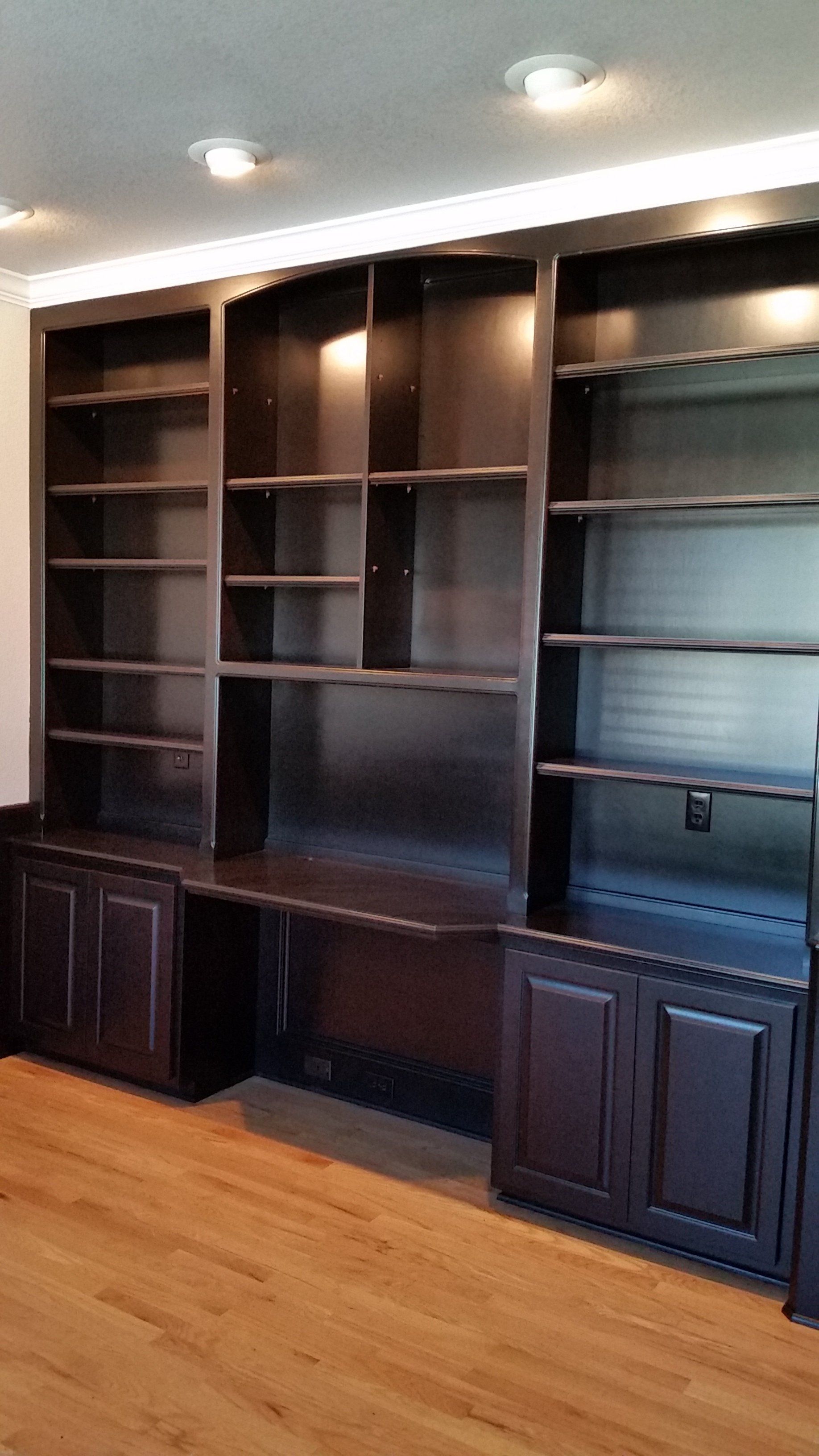 before painting dark wooden living room cabinetry