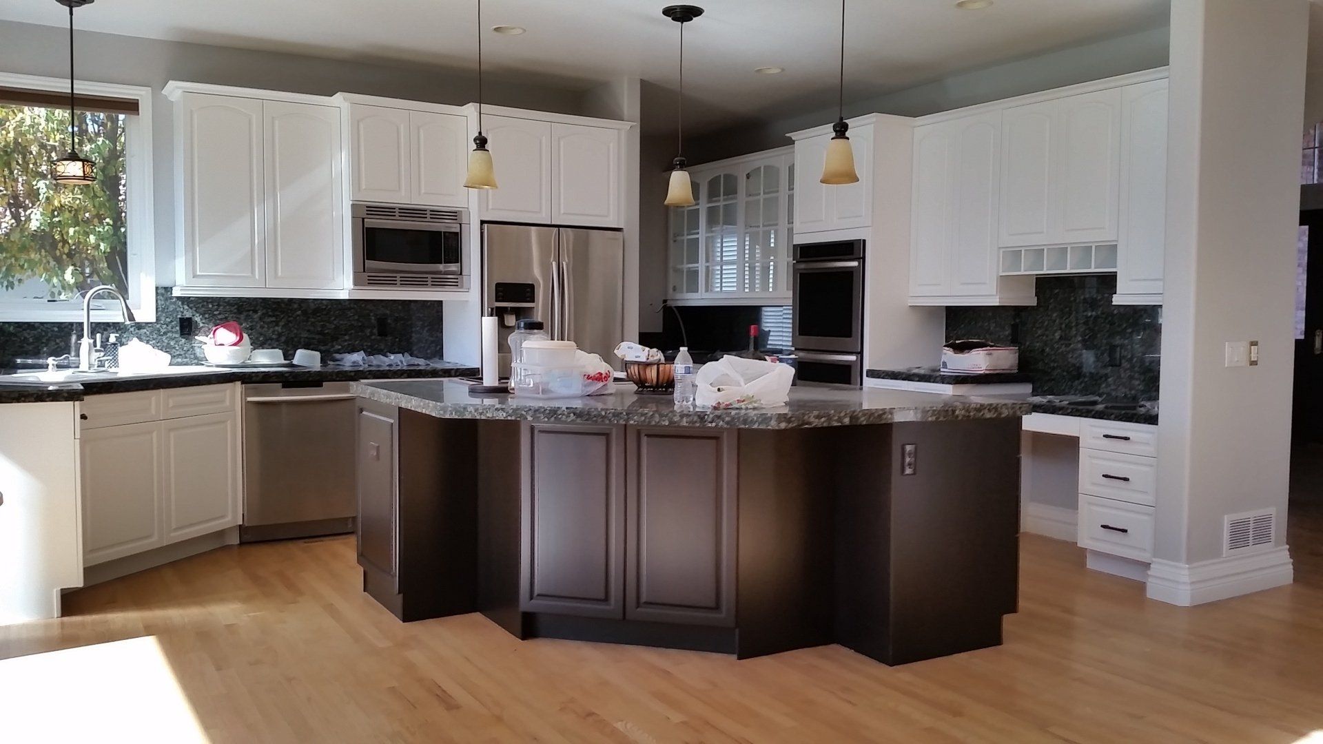 Painted white kitchen with espresso kitchen island