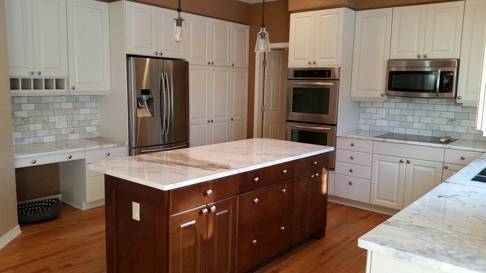 white kitchen, natural walnut finish on kitchen island