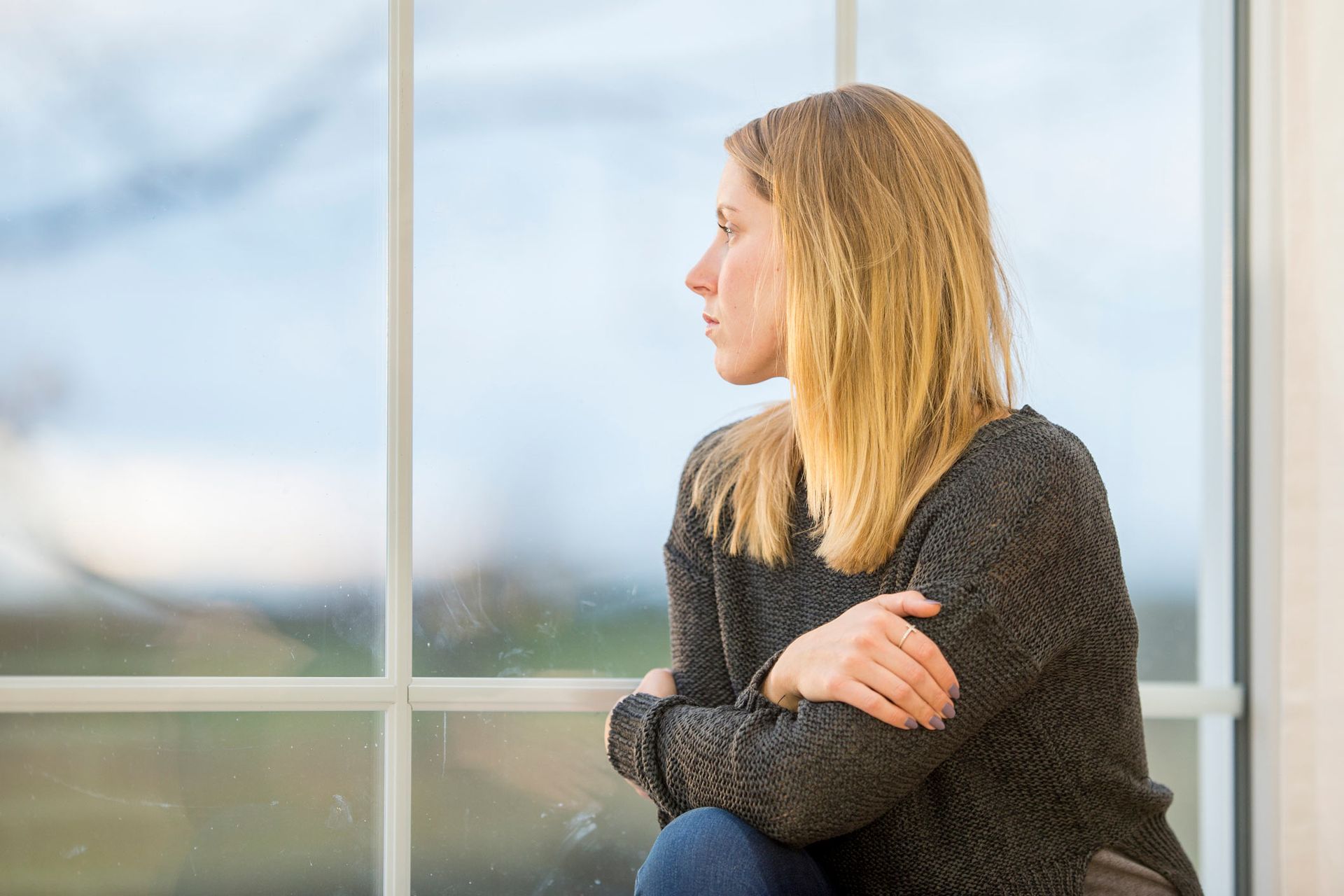Young Woman Looks Out The Window Pensively - Williamsburg, VA - Family Living Institute Young Woman Looks Out The Window Pensively - Williamsburg, VA - Family Living Institute