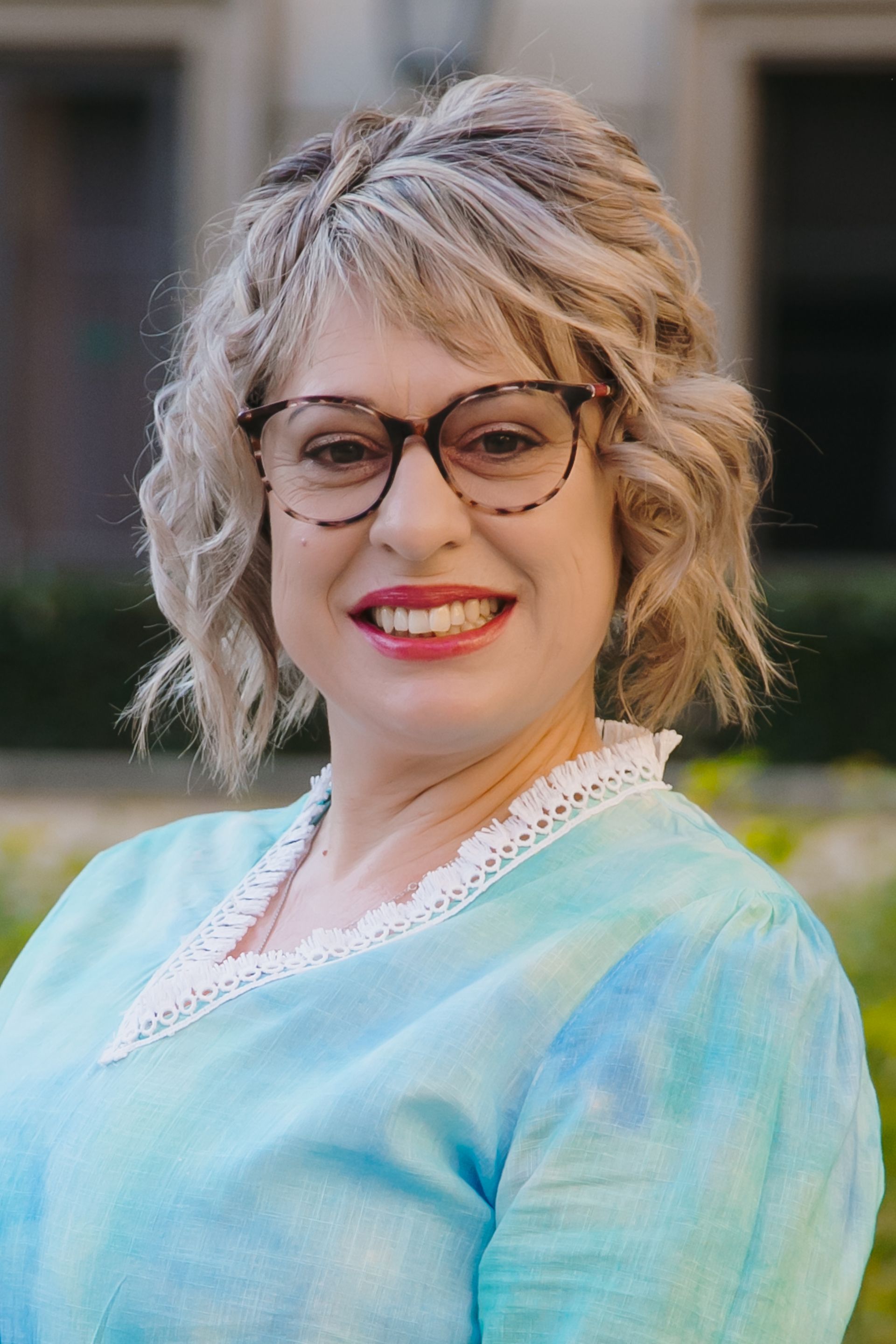 Corporate headshot of neurodiverse person