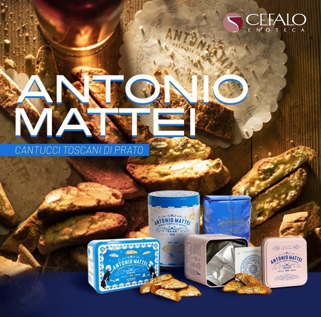 Biscotti Antonio Mattei Cantucci e scatole decorative blu e rosa esposte su una superficie di legno.