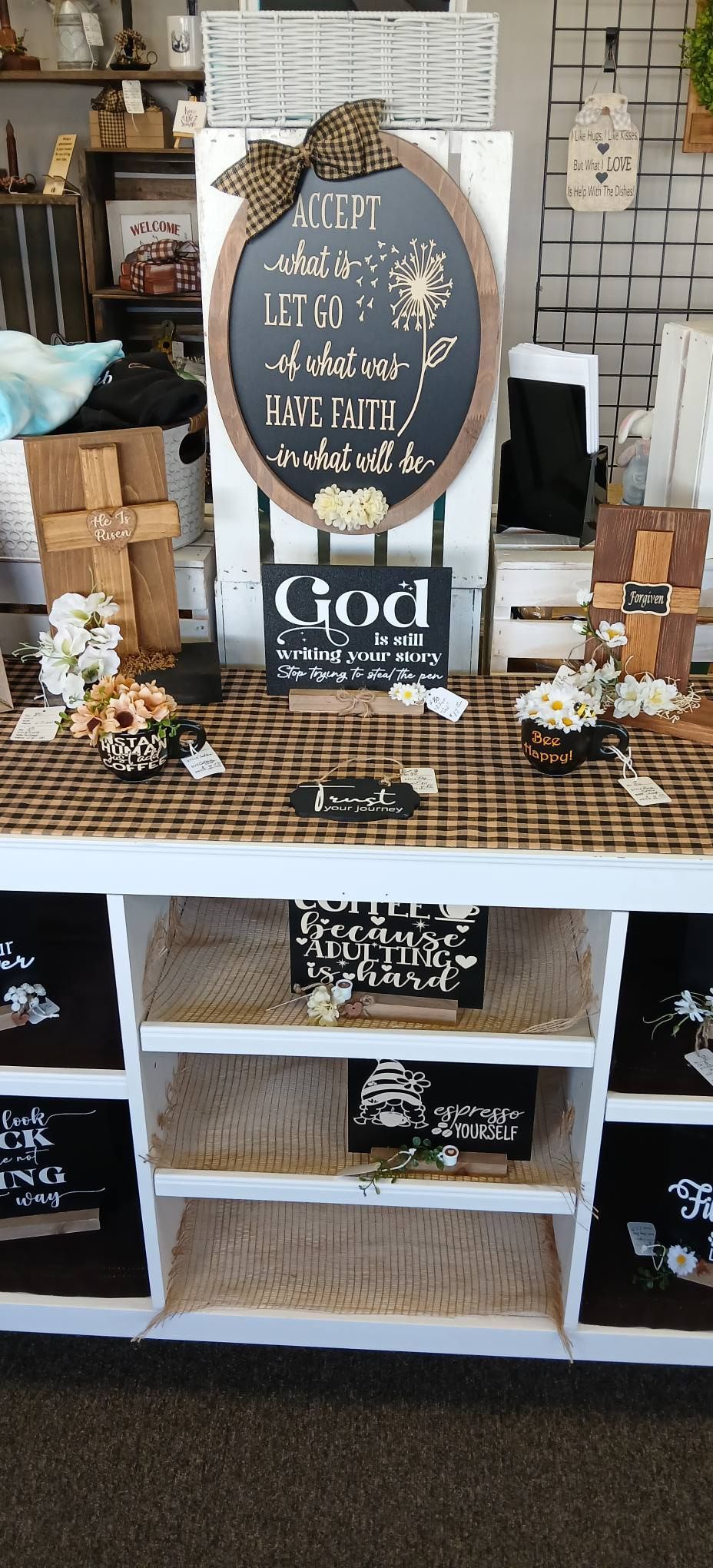 Rustic farmhouse coffee bar with chalkboard sign, white shelves, and brown decor accents