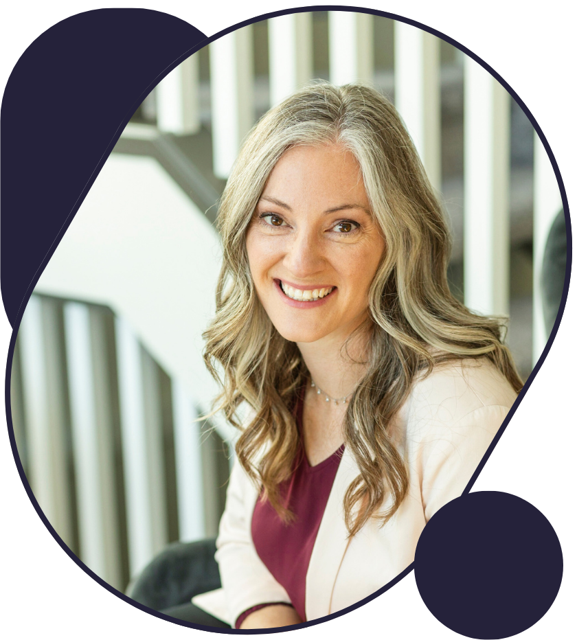 A woman is smiling in a circle with a staircase in the background.
