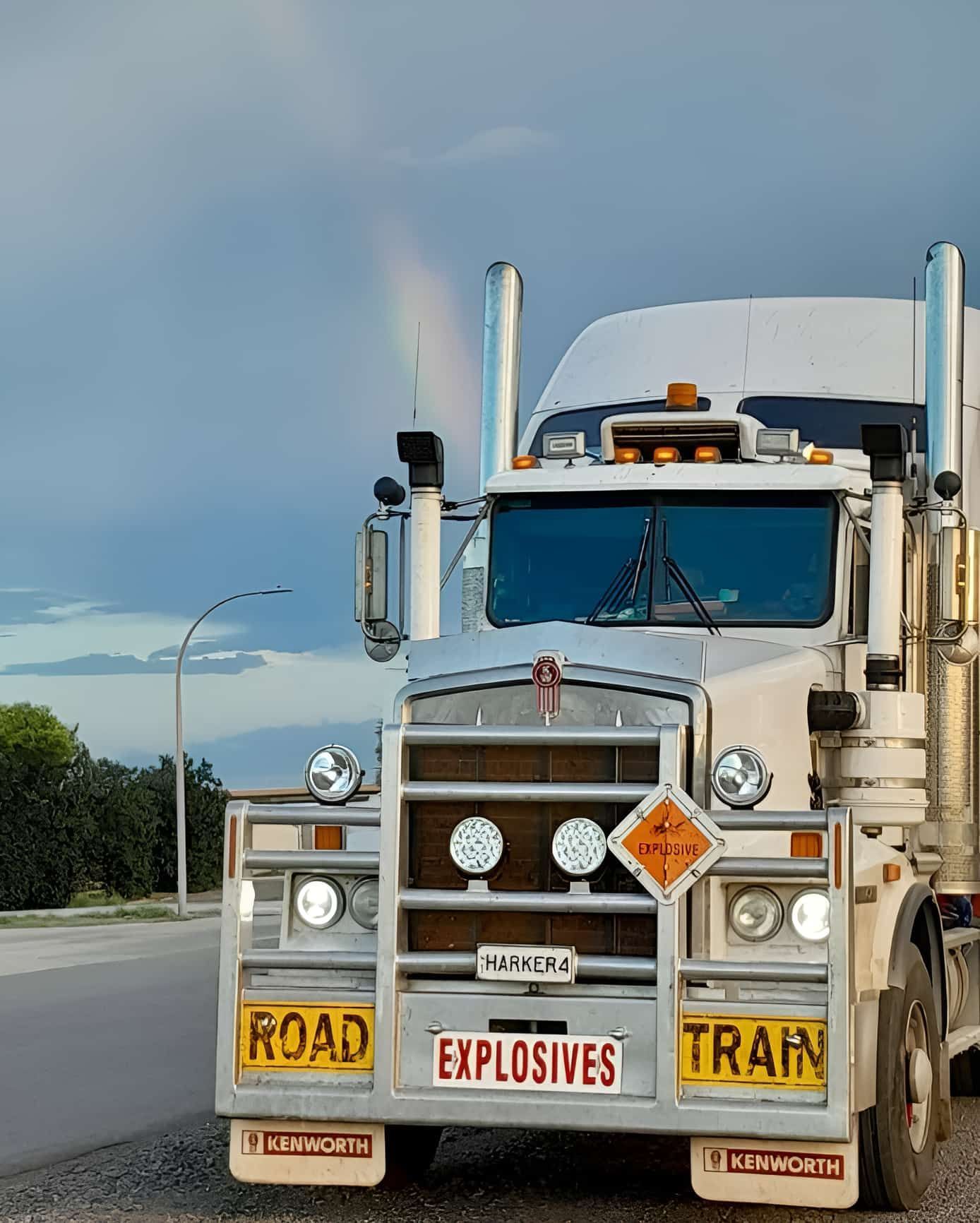 A Truck With a Sign on the Front That Says Road Explosives Train — Harker Haulage In East Arm, NT
