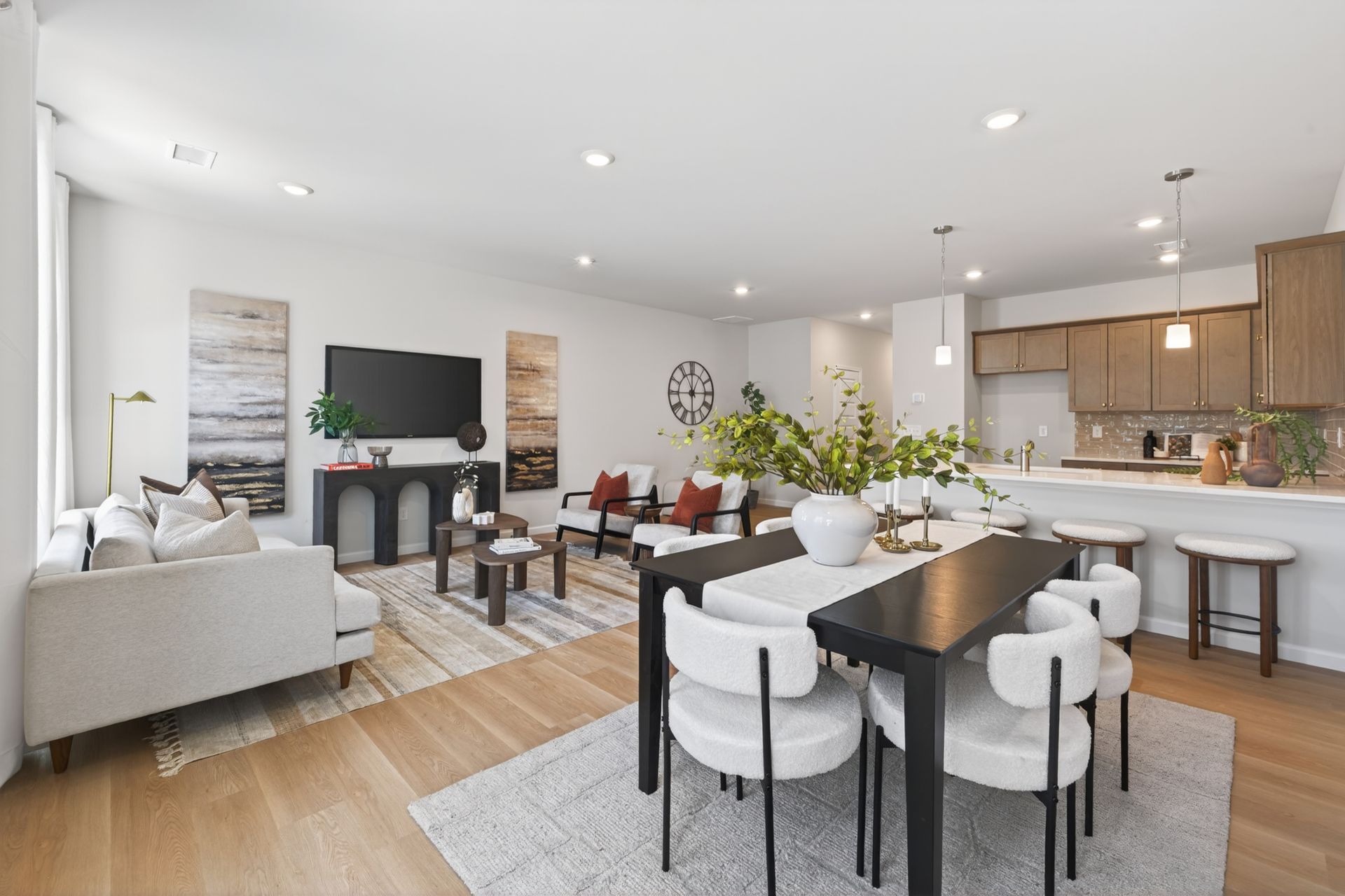 Living area of a home in Ruby Dixon Crossing showing the living room, dining room, and kitchen. 
