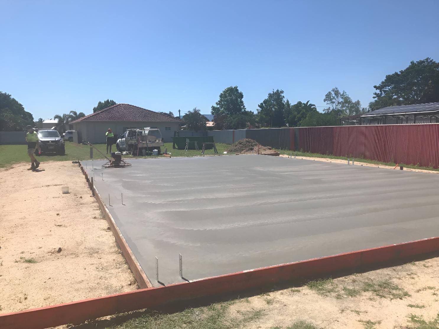 A Concrete Floor Is Being Built In A Backyard — Dunnrite Mareeba Sheds & Garages In Mareeba, QLD