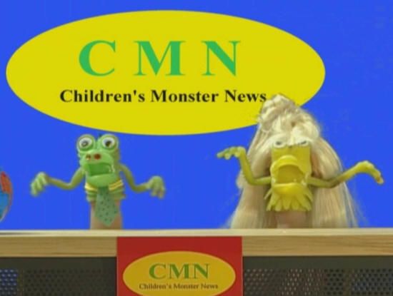 Two puppet monsters in front of a