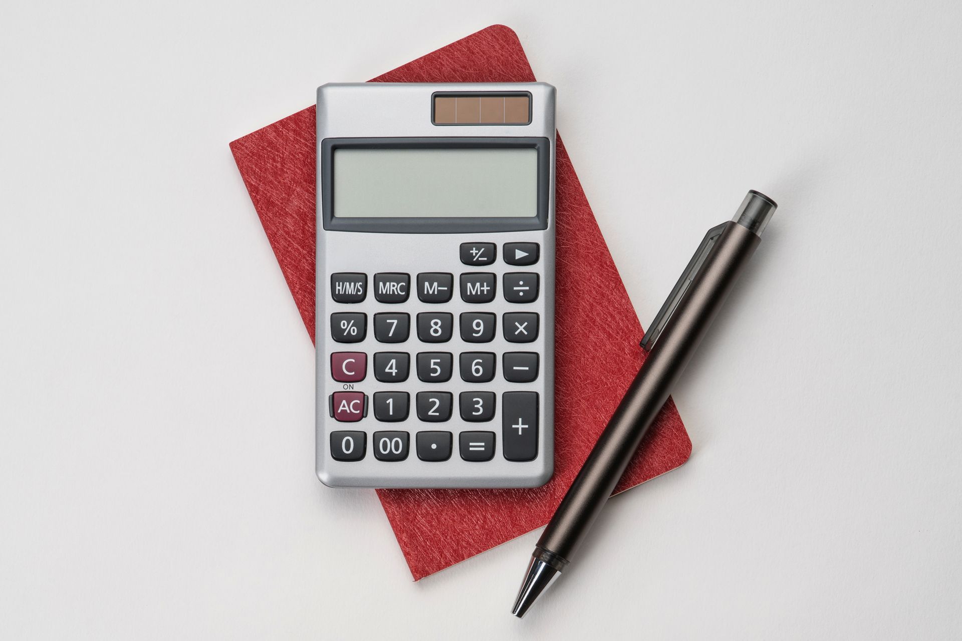 Calculator, Pen and Red Notebook Calculator, Pen and Red Notebook