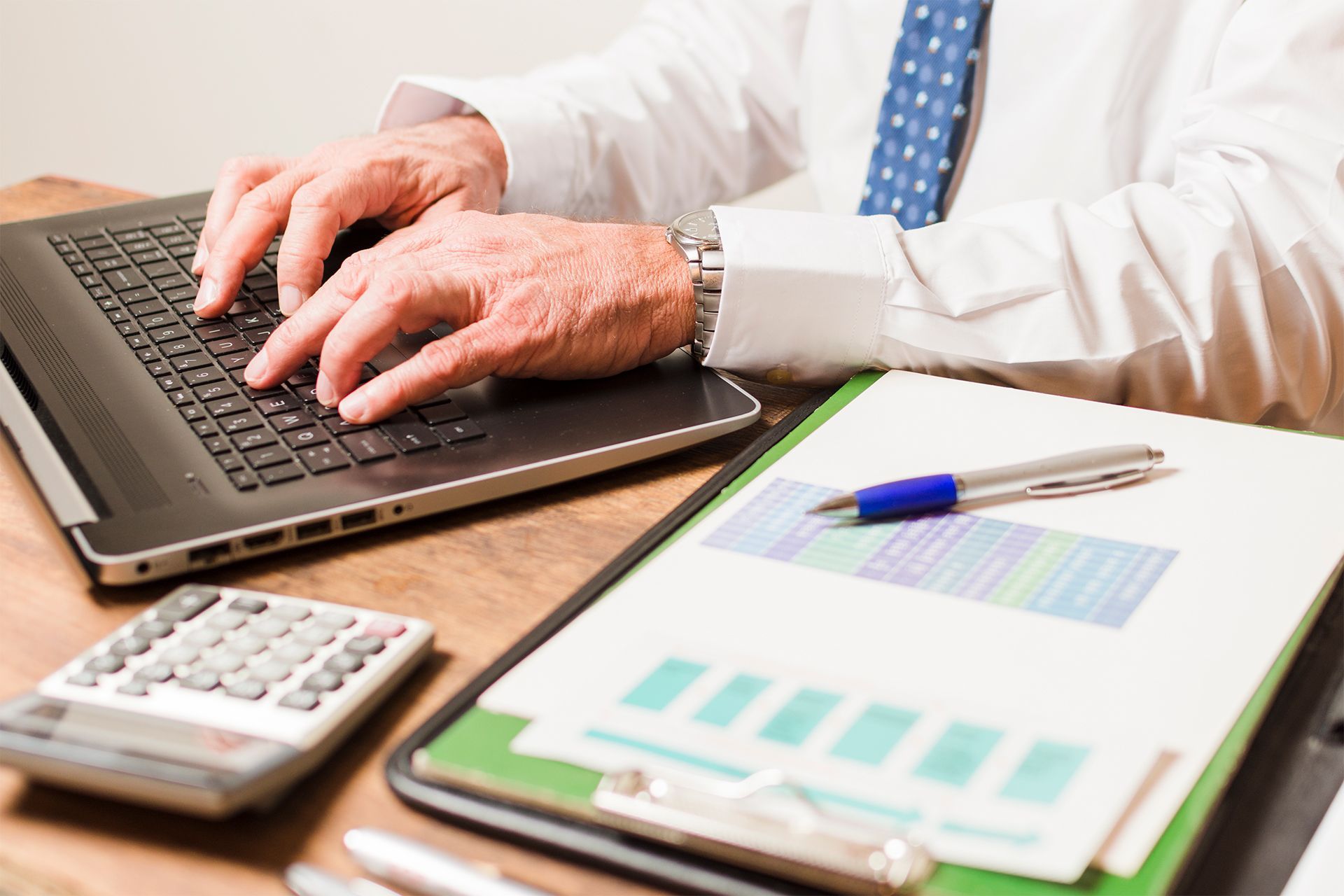 Accountant Typing on a Laptop Accountant Typing on a Laptop