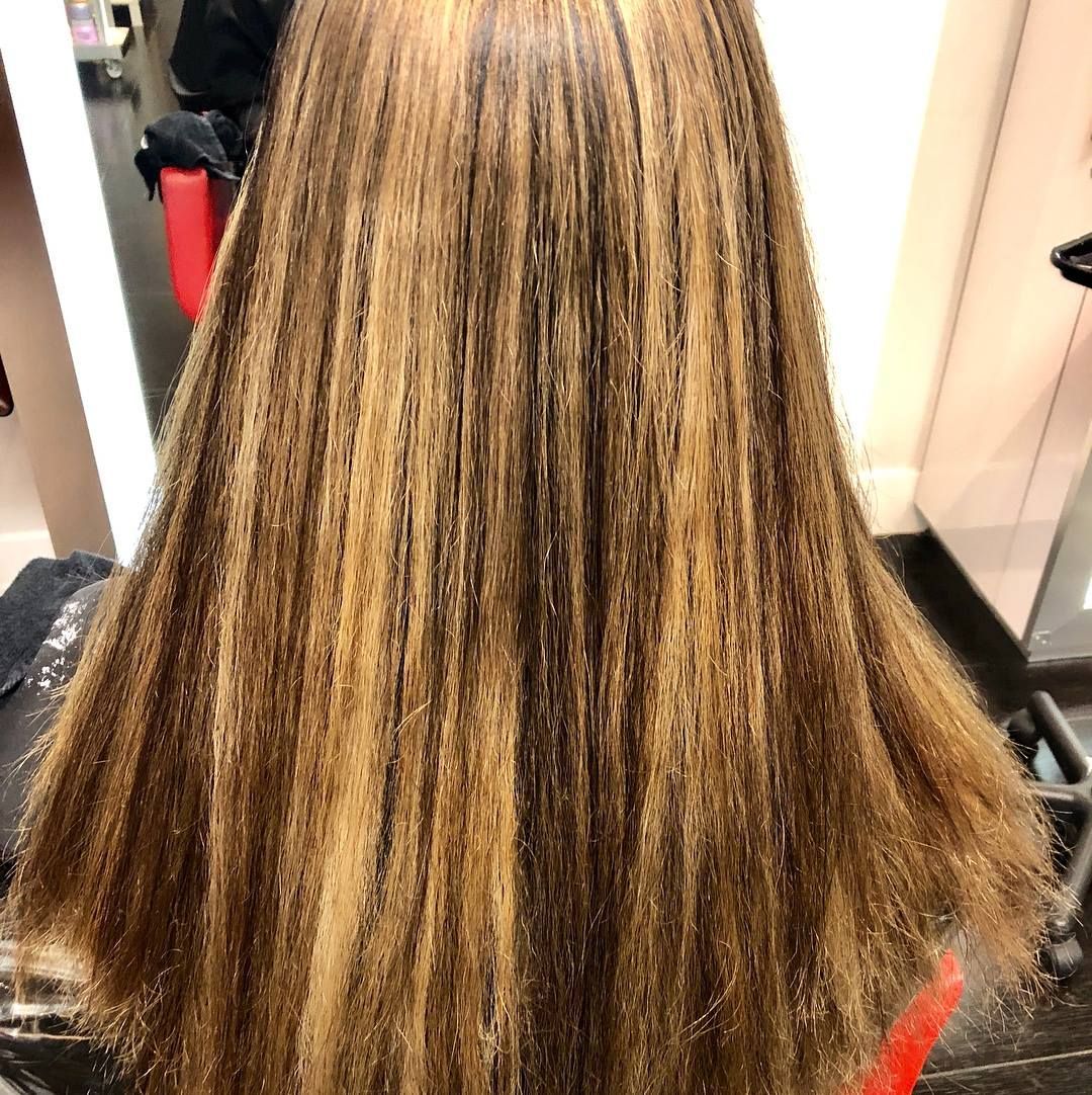 Brown hair with blonde highlights.