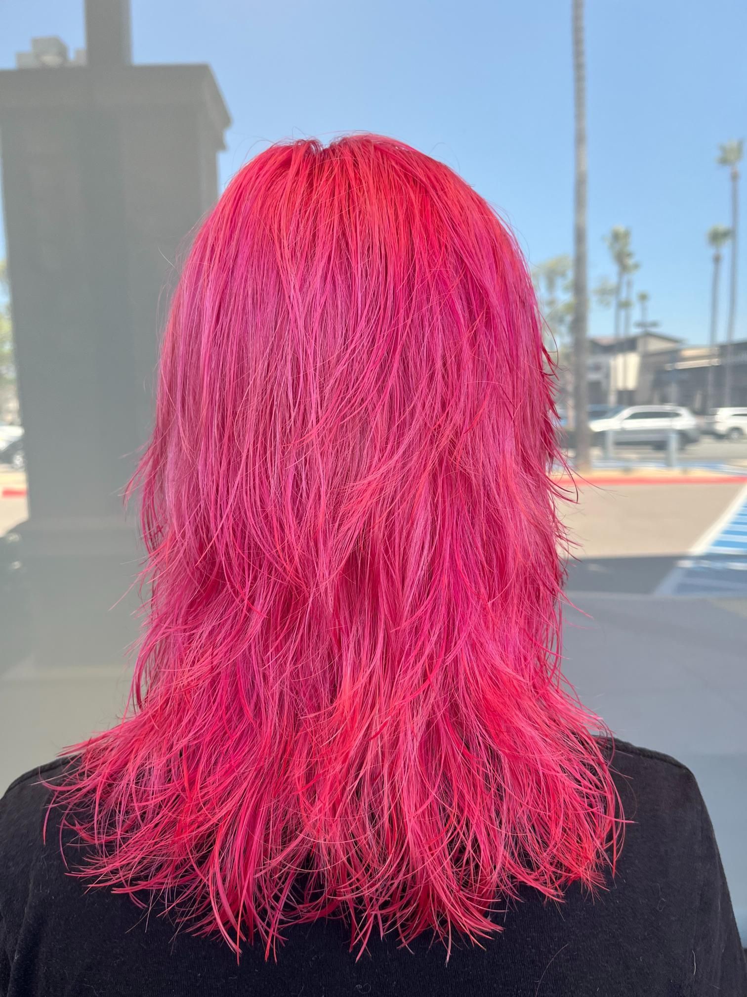 Pink layered hair, outdoors, bright sunlight.