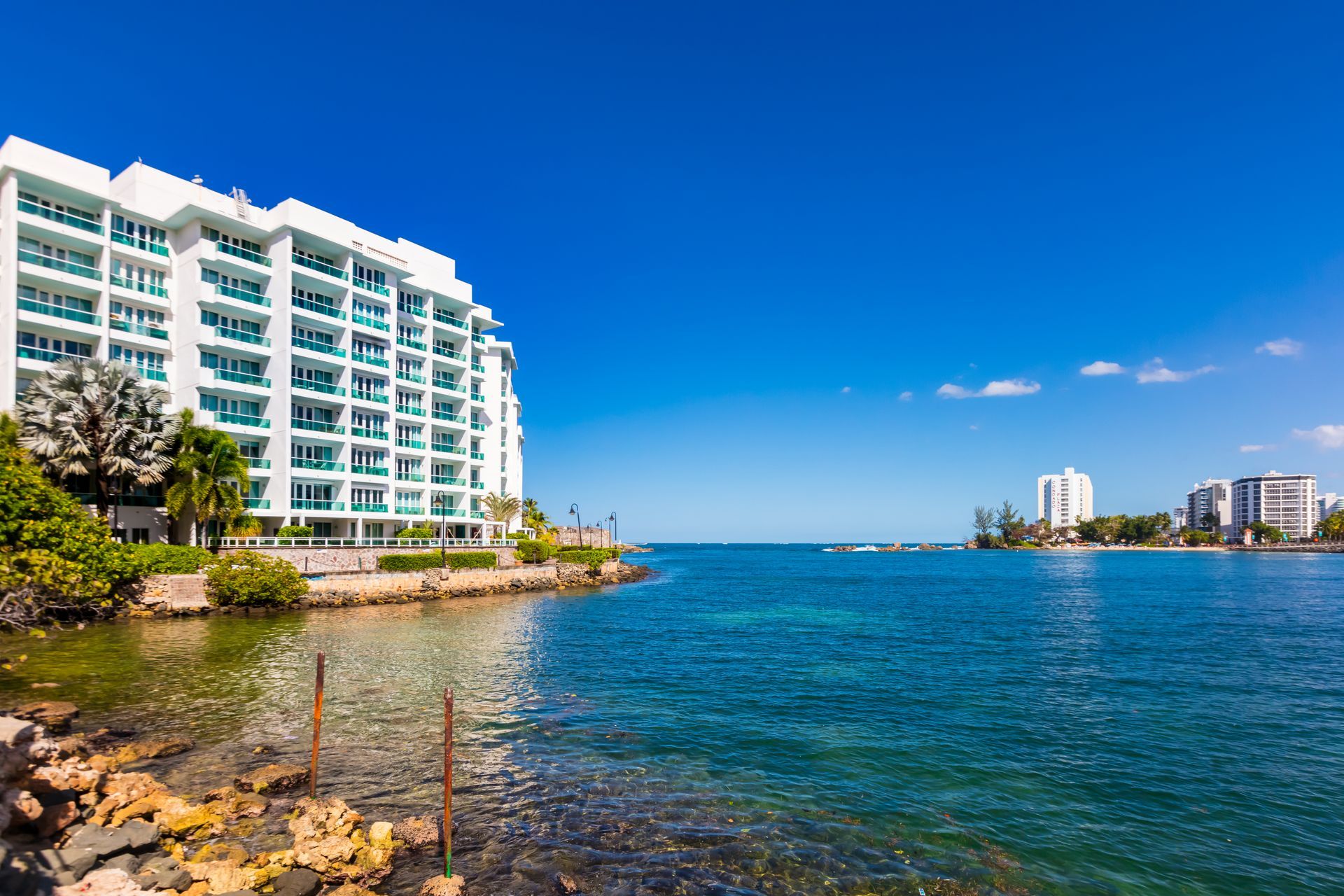 Waterfront buildings along the Condado Lagoon with the San Juan coastline in the distance, Puerto Rico