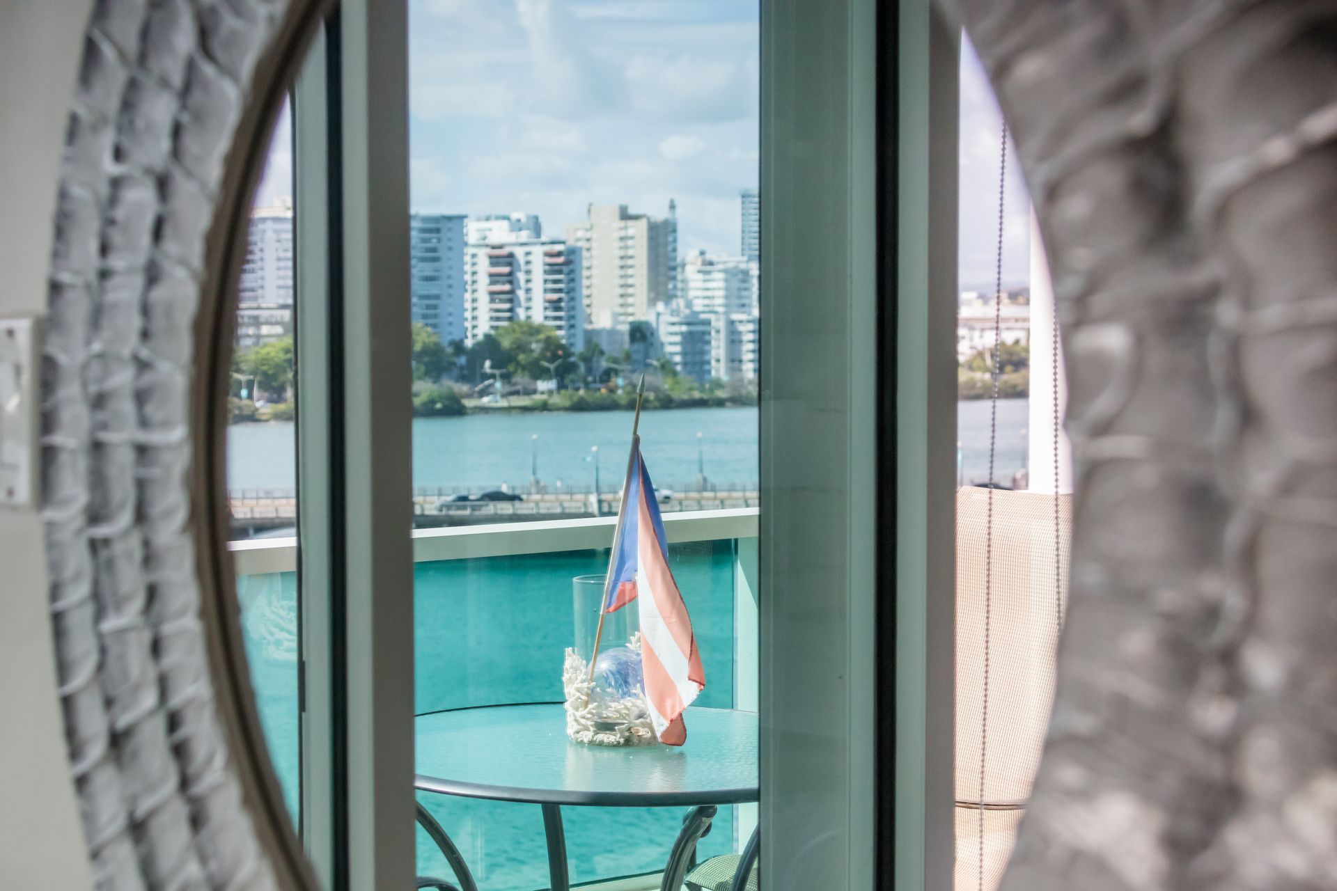 Balcony view of the Condado Lagoon and San Juan skyline from a waterfront vacation rental in Puerto 