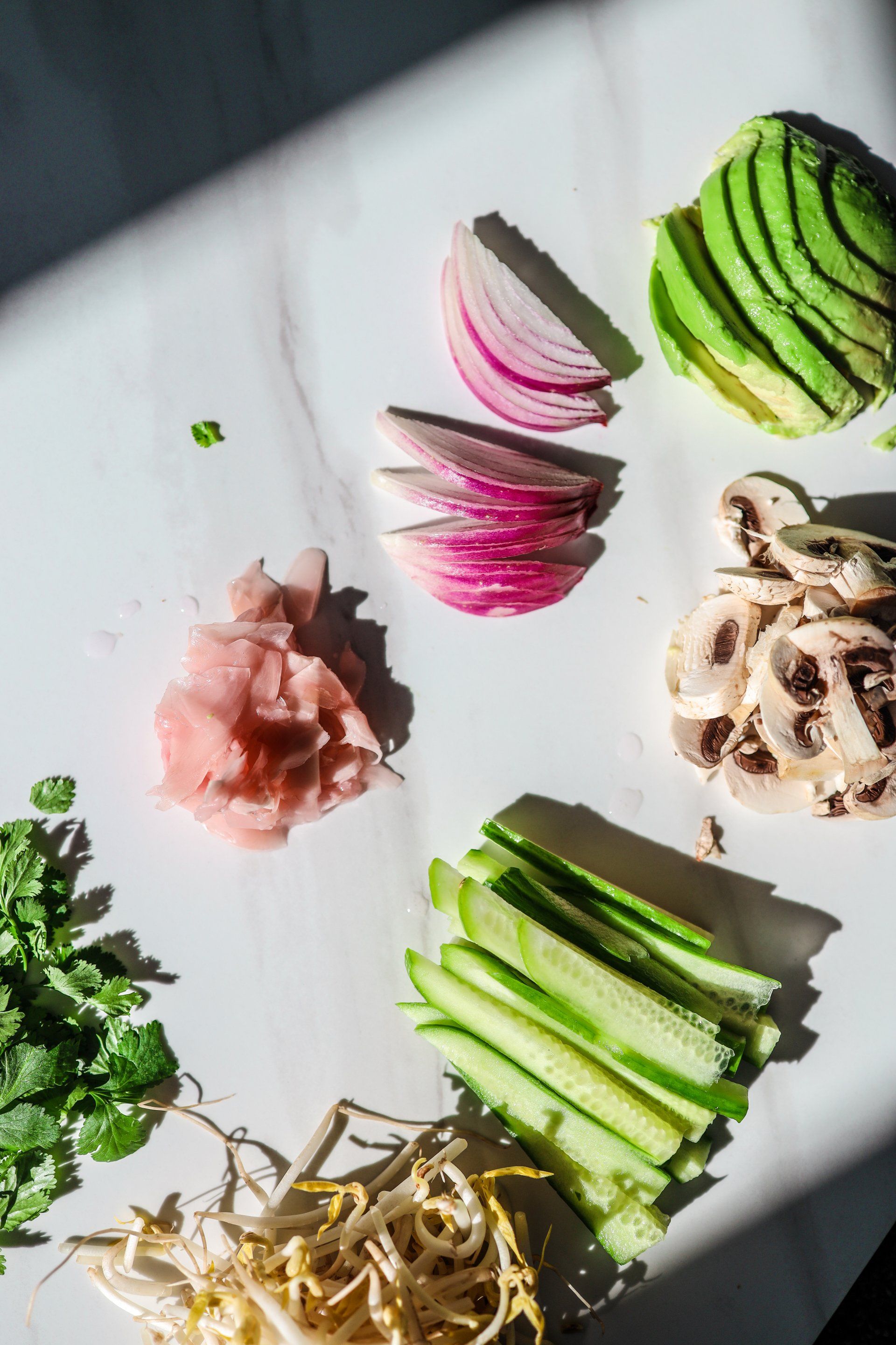 There are many different types of vegetables on the table.