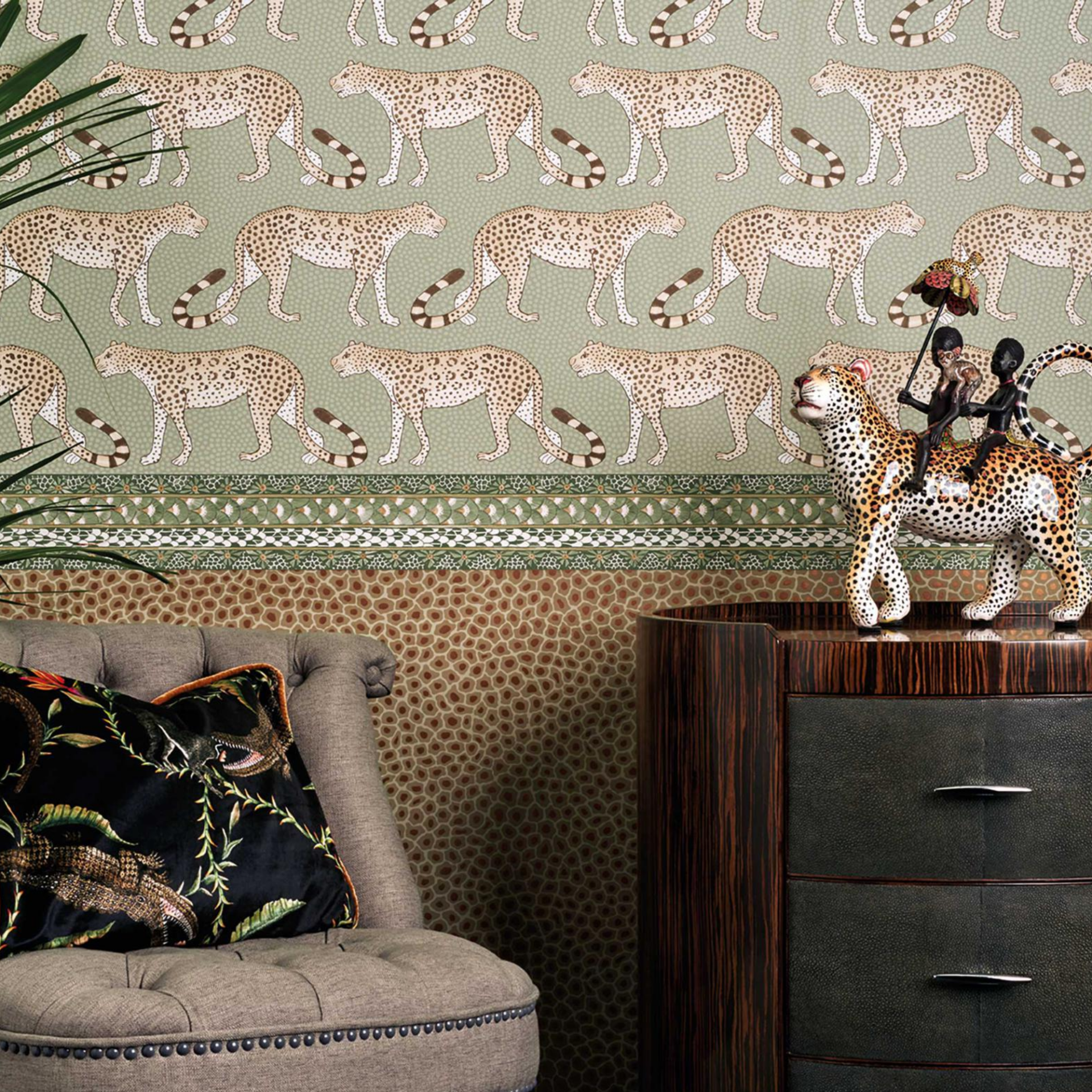 A room with a leopard print wallpaper and a chair