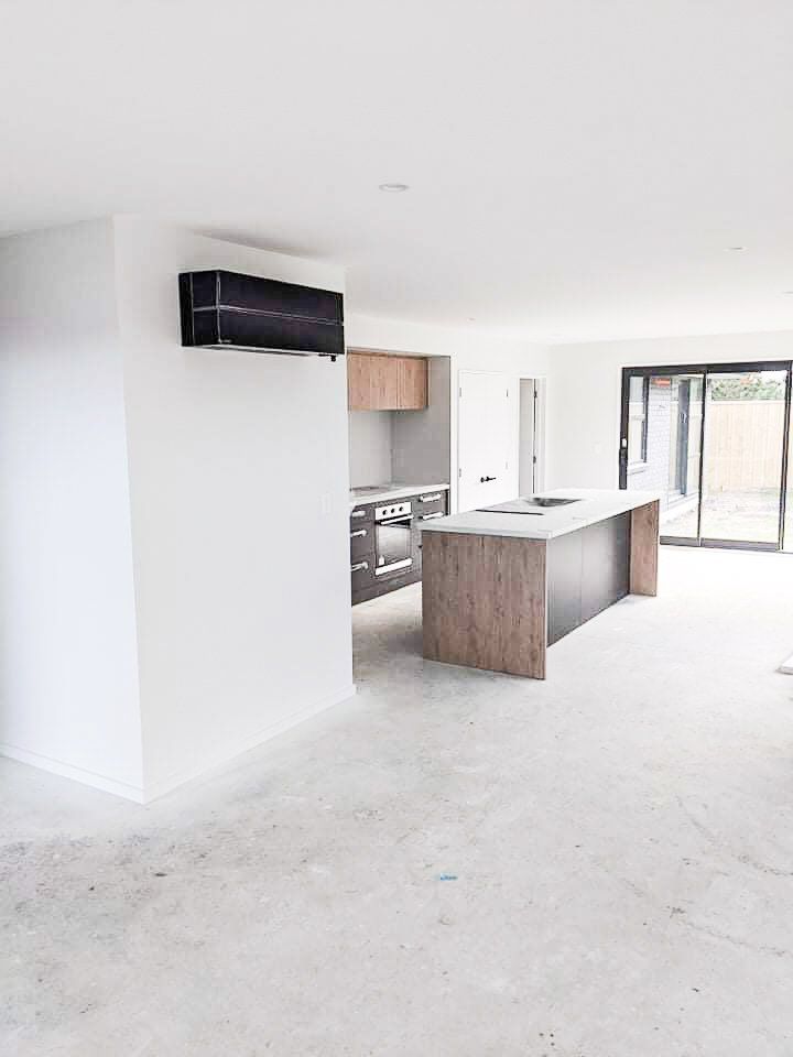 A kitchen with a large island in the middle of the room.