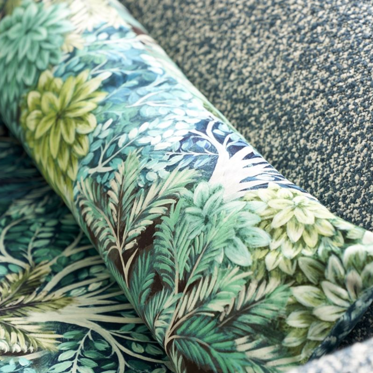 A close up of a fabric with leaves and flowers on it