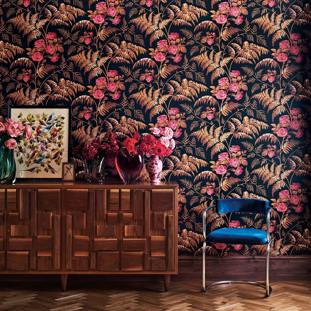 A room with a wooden dresser and a blue chair