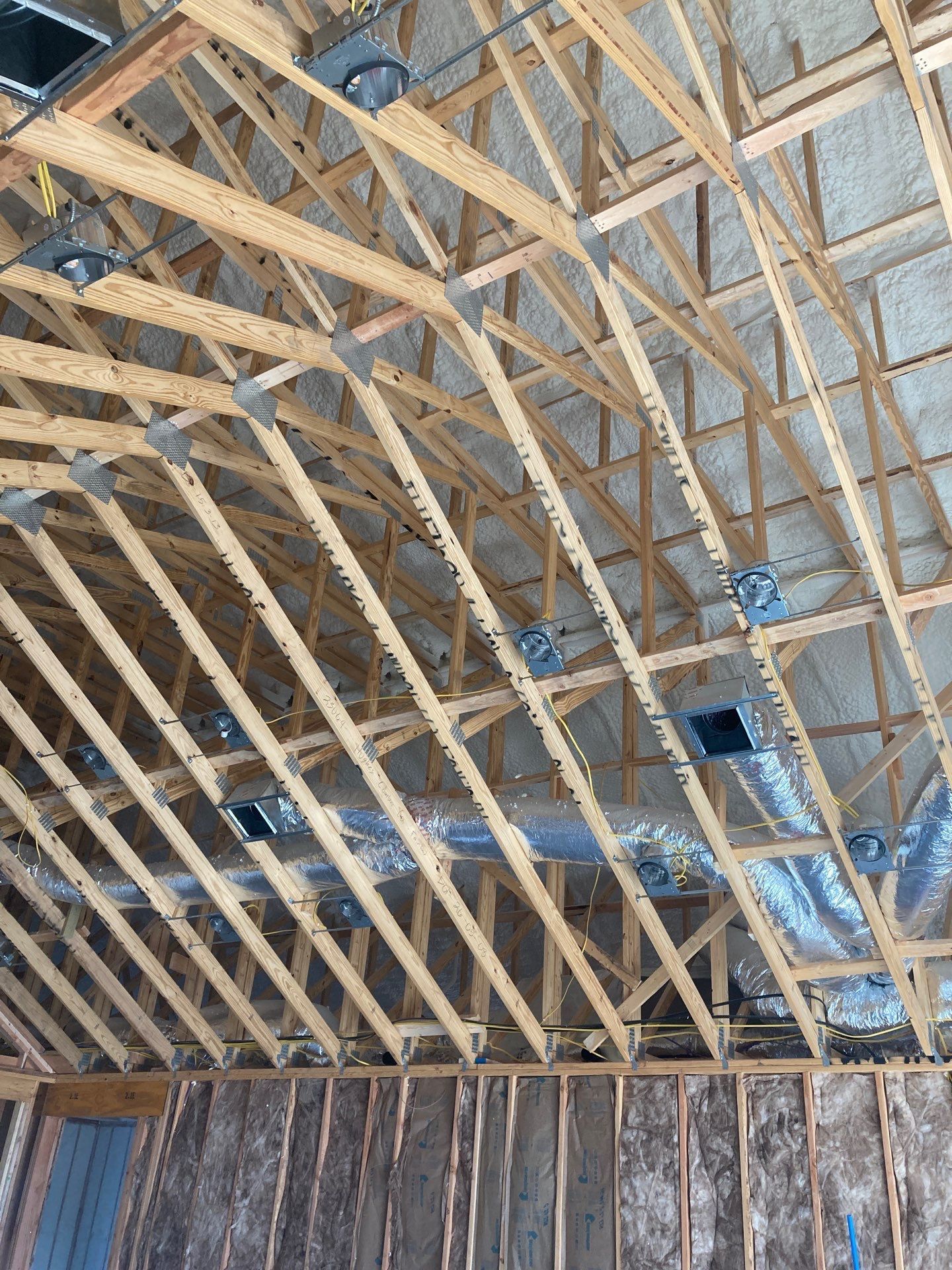 A picture of the ceiling of a building under construction.