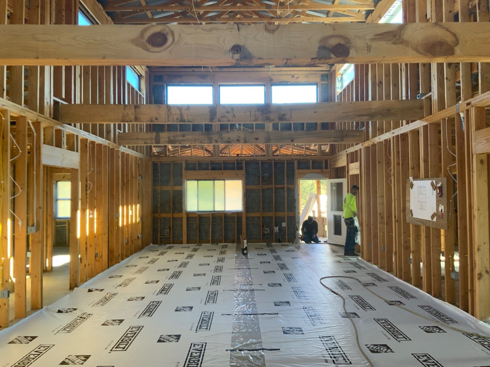 The inside of a building under construction with a white floor