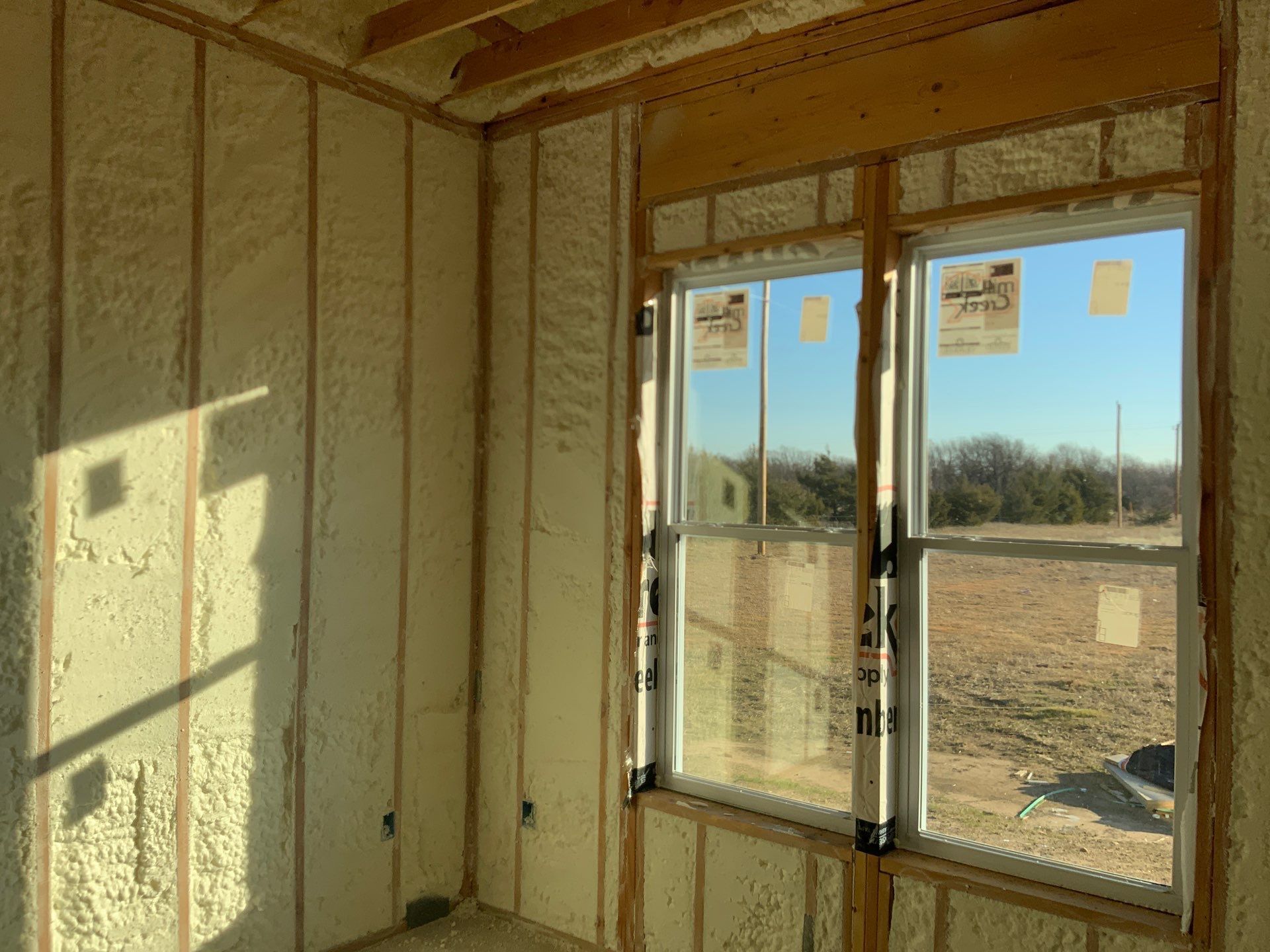 A room with a lot of insulation on the walls and windows.