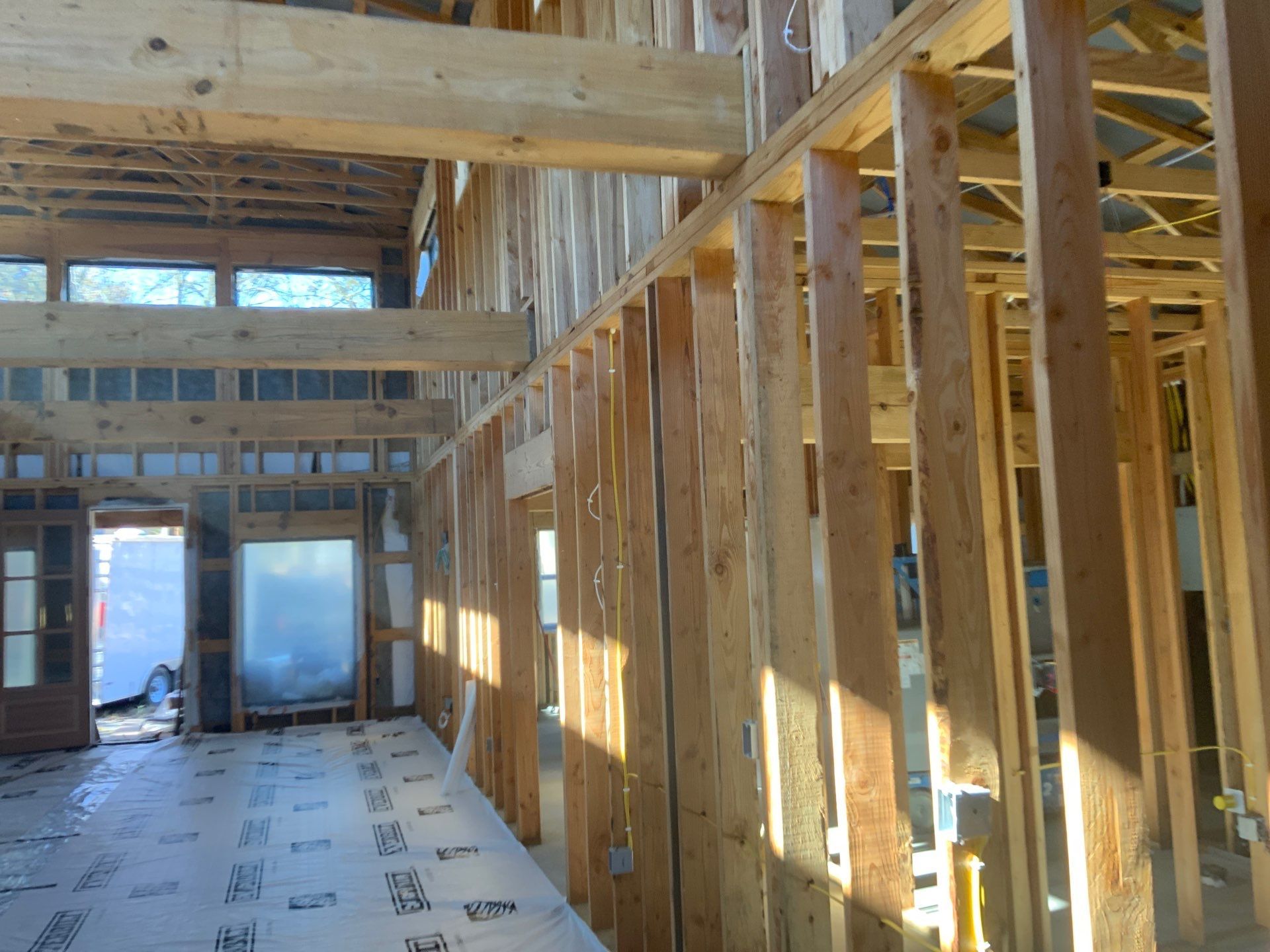 A house is being built with a lot of wooden beams