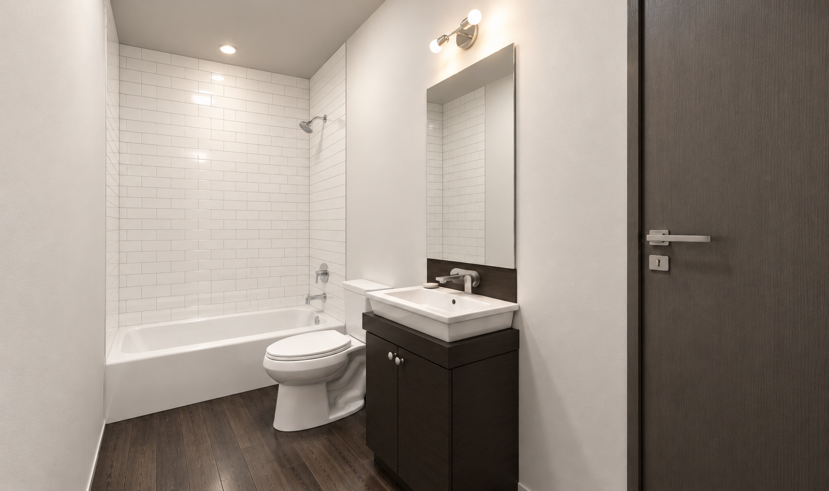 Artist's Rendering - Modern bathroom with bathtub, toilet, vanity sink, and gray door