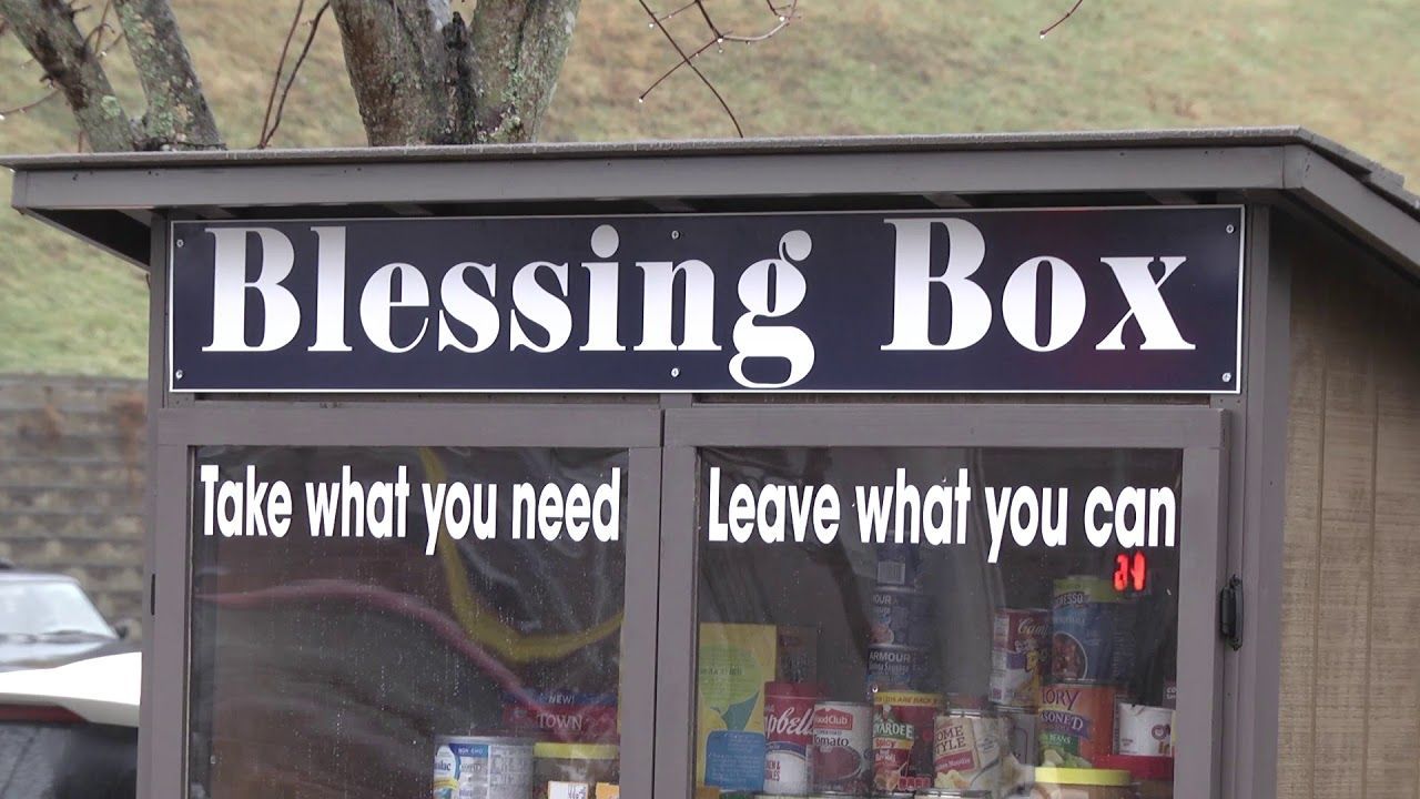 A blessing box that says take what you need and leave what you can