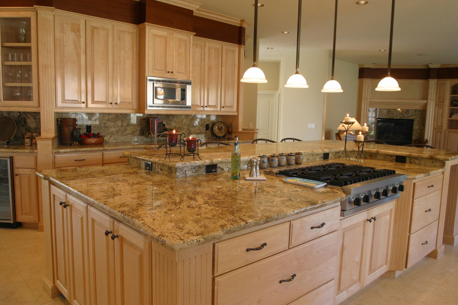 A kitchen with wooden cabinets and granite countertops.