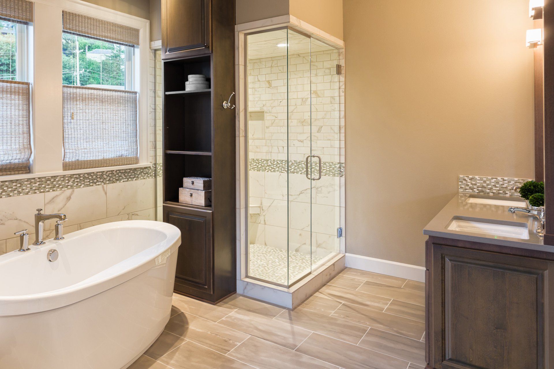 A bathroom with a bathtub, sink, and walk-in shower.